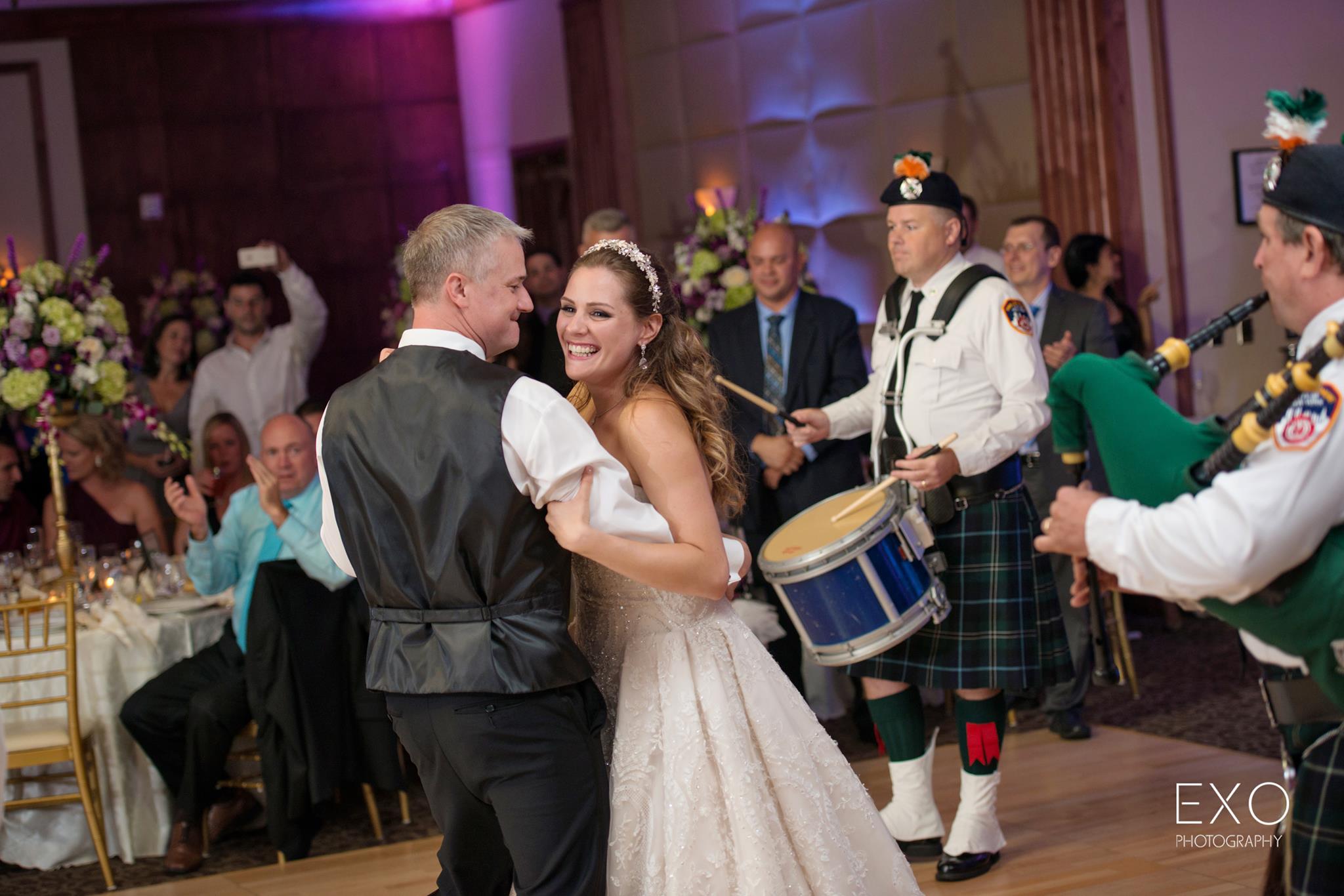 bride and groom dancing to music by party train 
