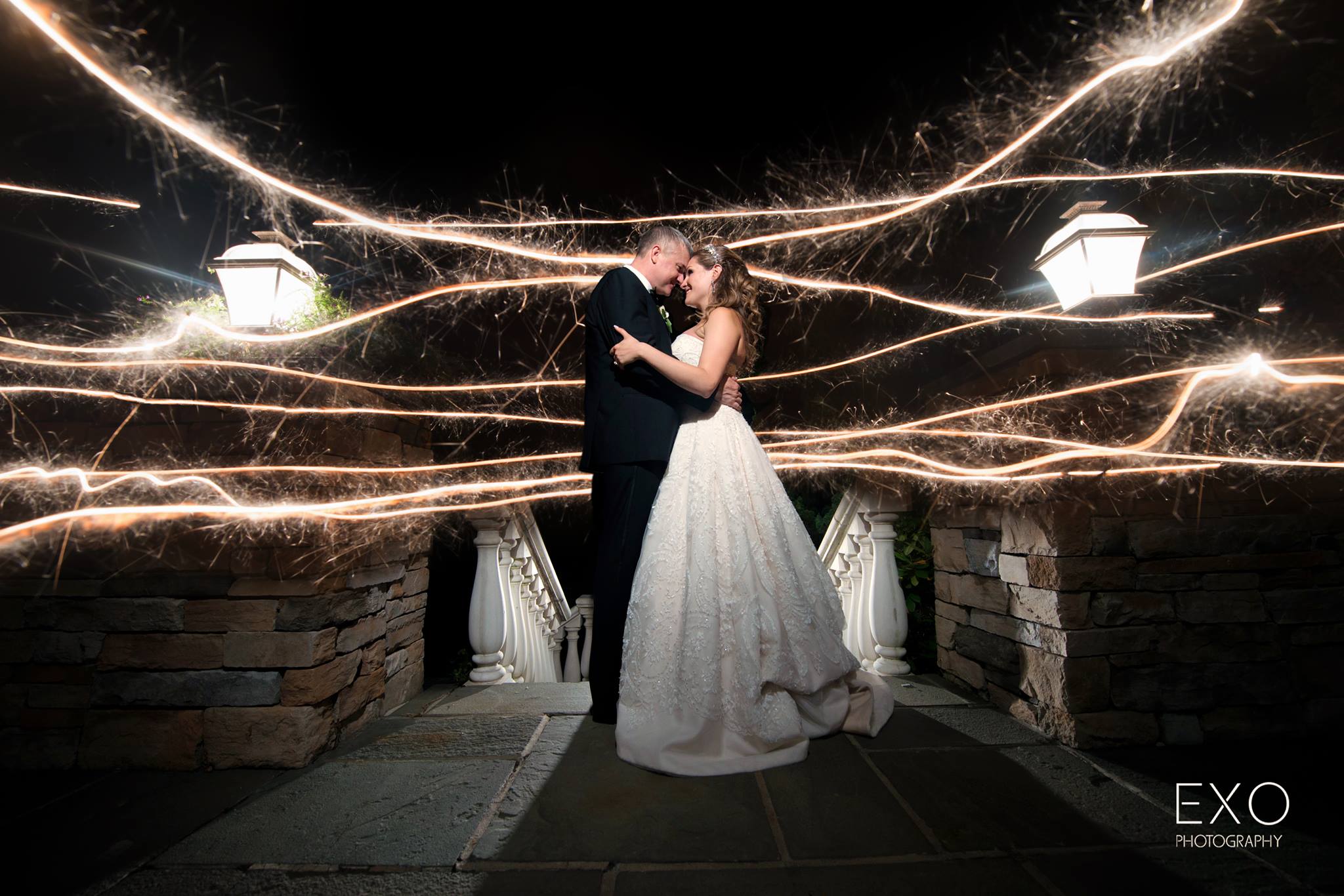 evening shot with light streams at Willow Creek Golf and Country Club wedding