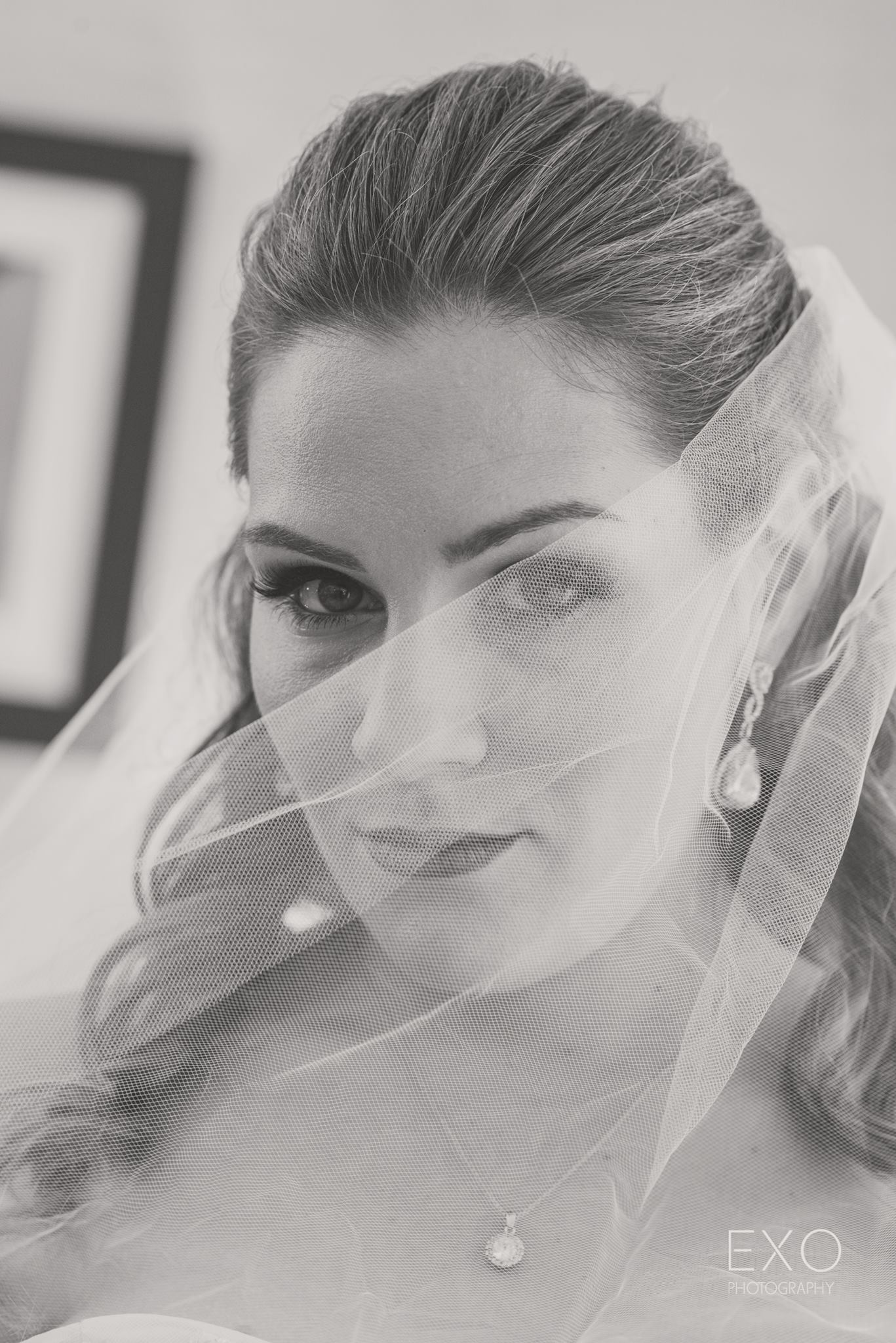 black and white image of bride with wedding veil