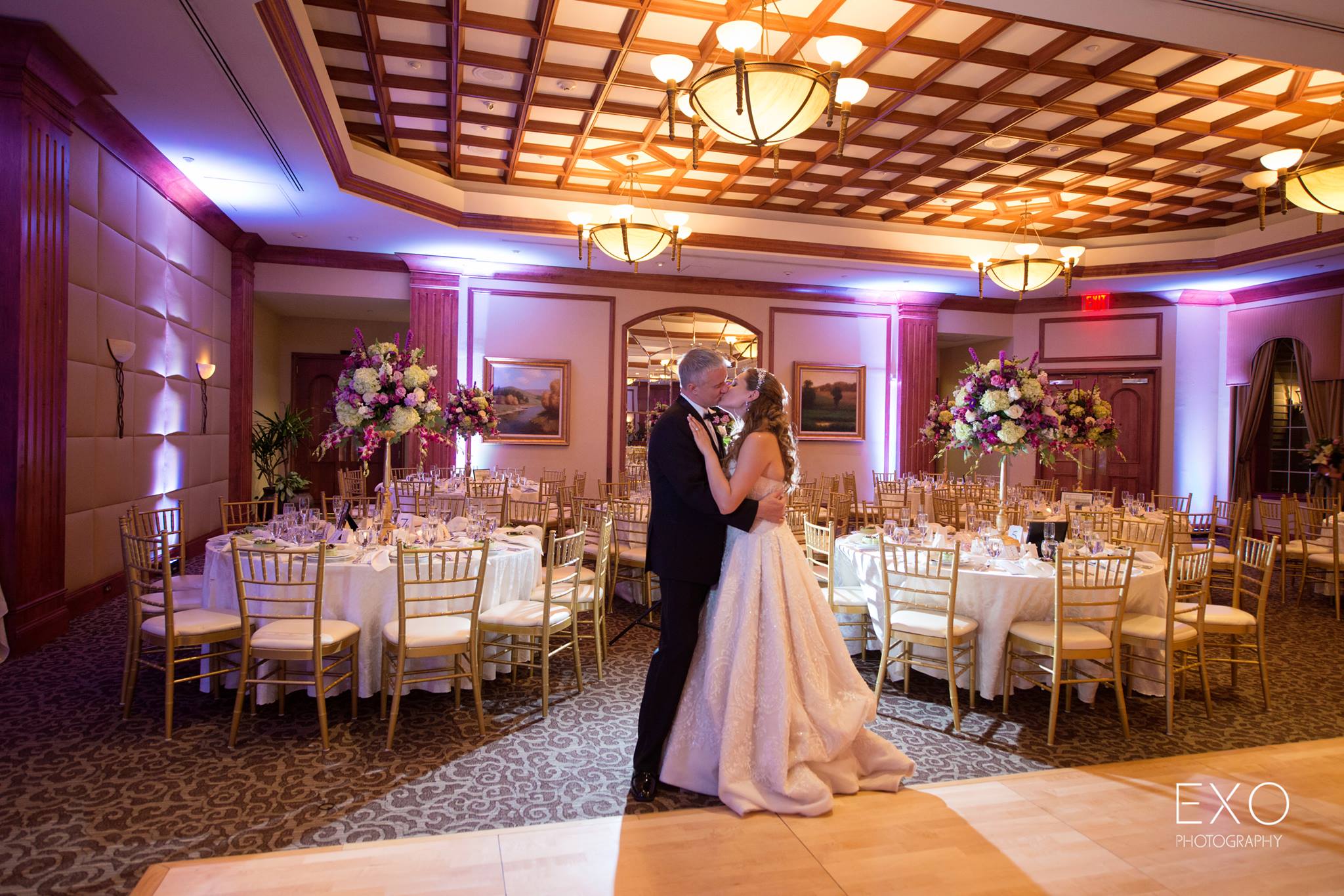 bride and groom kissing at Willow Creek Golf and Country Club wedding reception