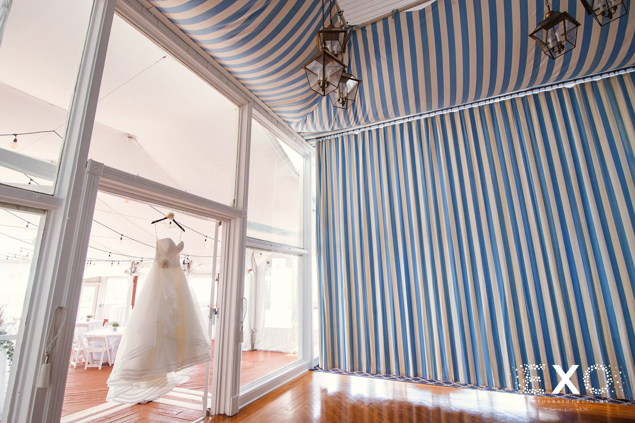 brides by demetrios gown hanging in empty room