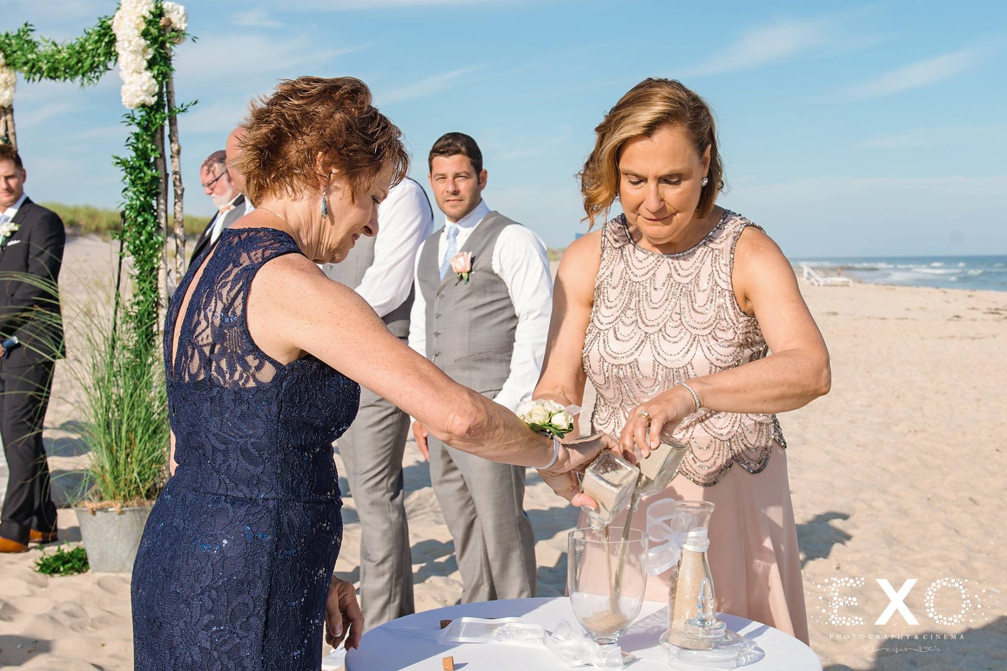mother of bride and groom pouring sand during ceremony