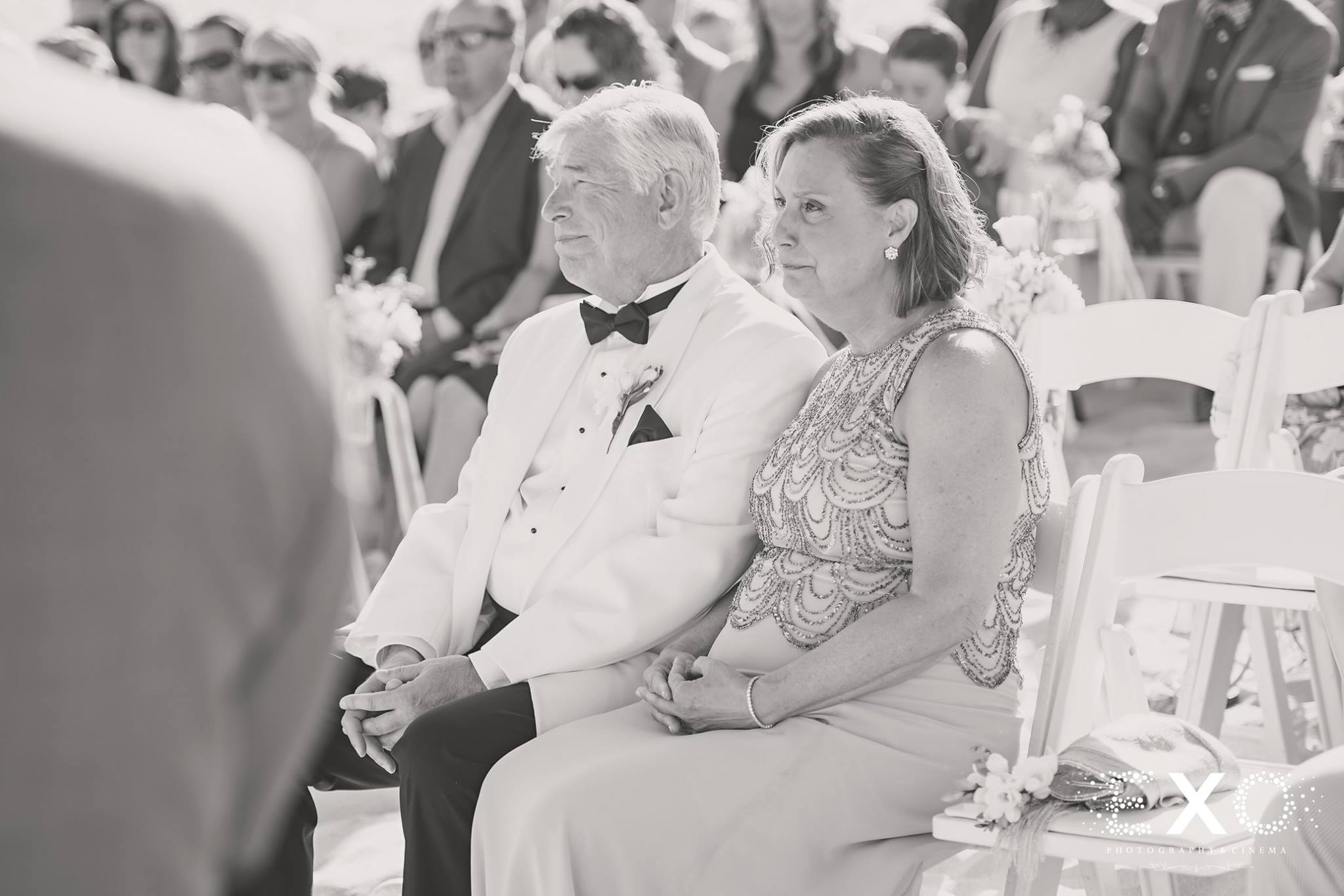 black and white image of parents during ceremony