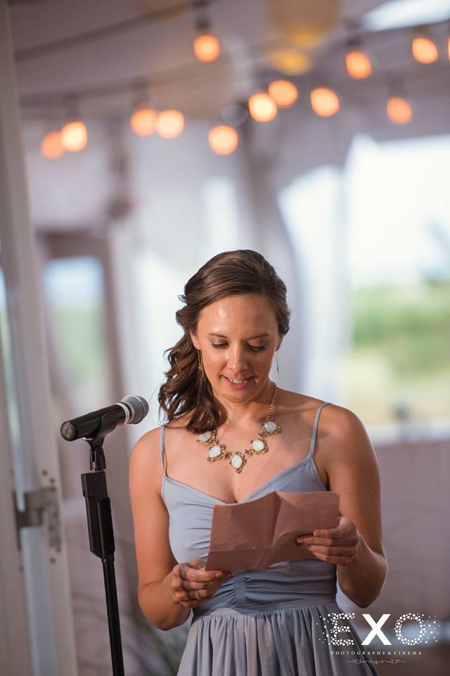 bridesmaid giving speech at reception