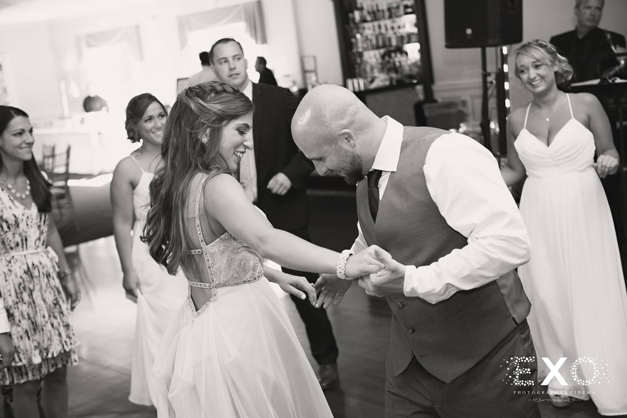 black and white image of bride and groom dancing to naked truth music