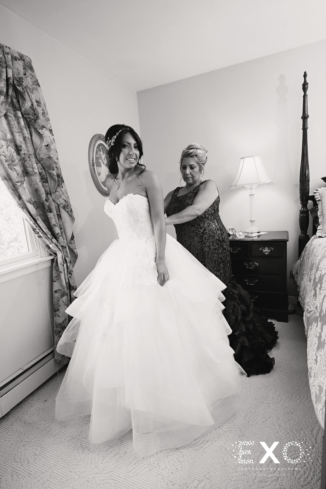 black and white image of bride getting ready 