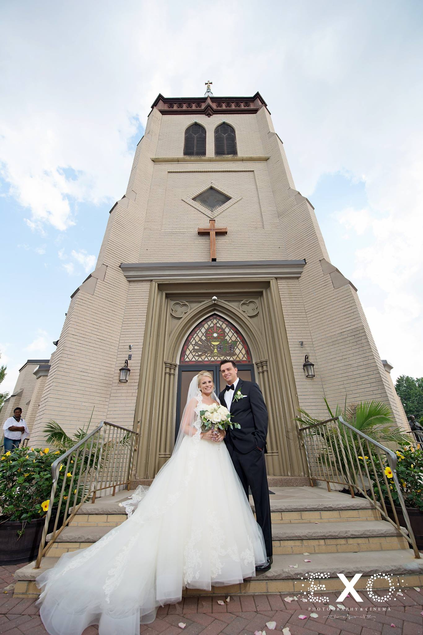 bride and groom outside st. hedwigs church in floral park