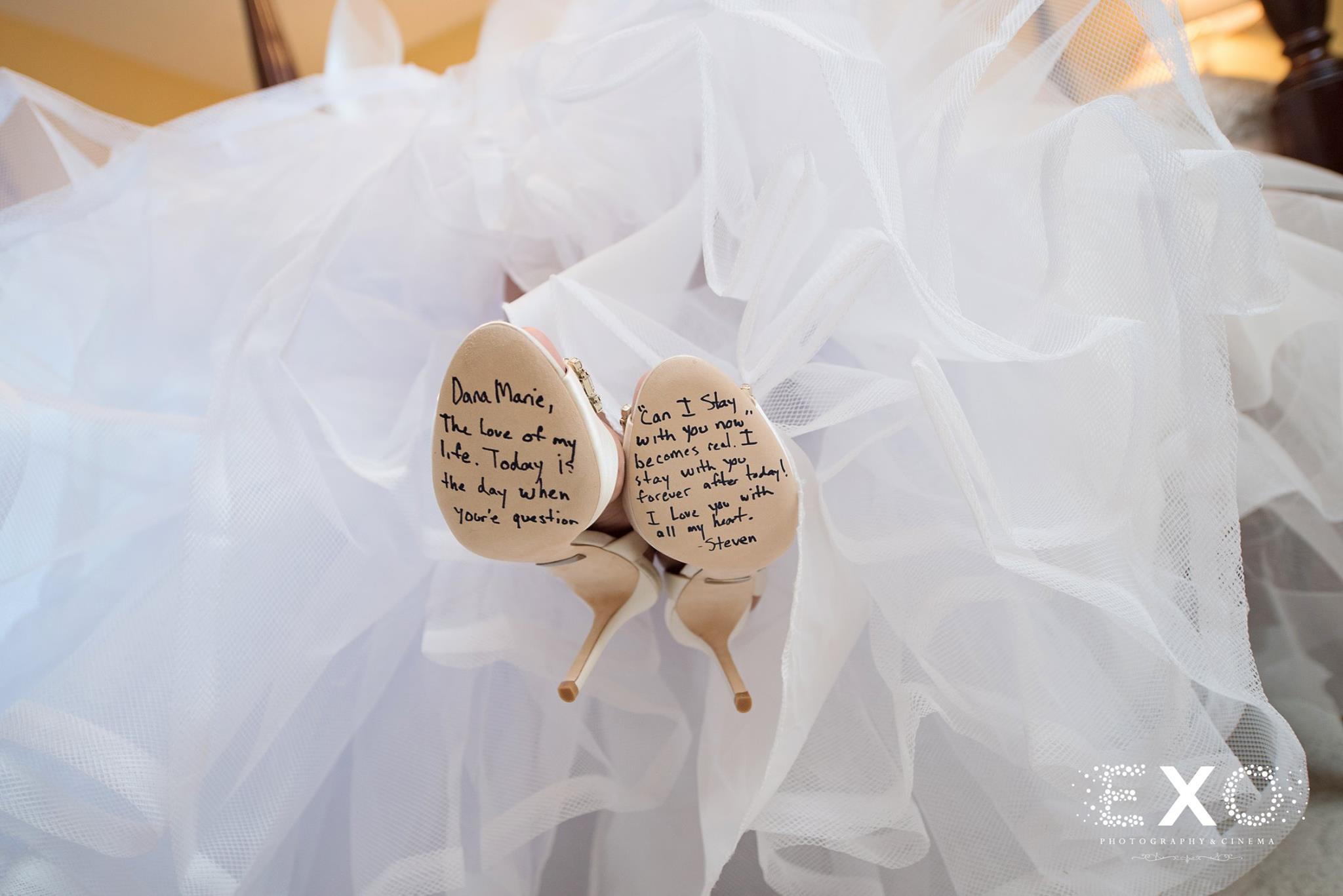 shot of brides shoes with message written
