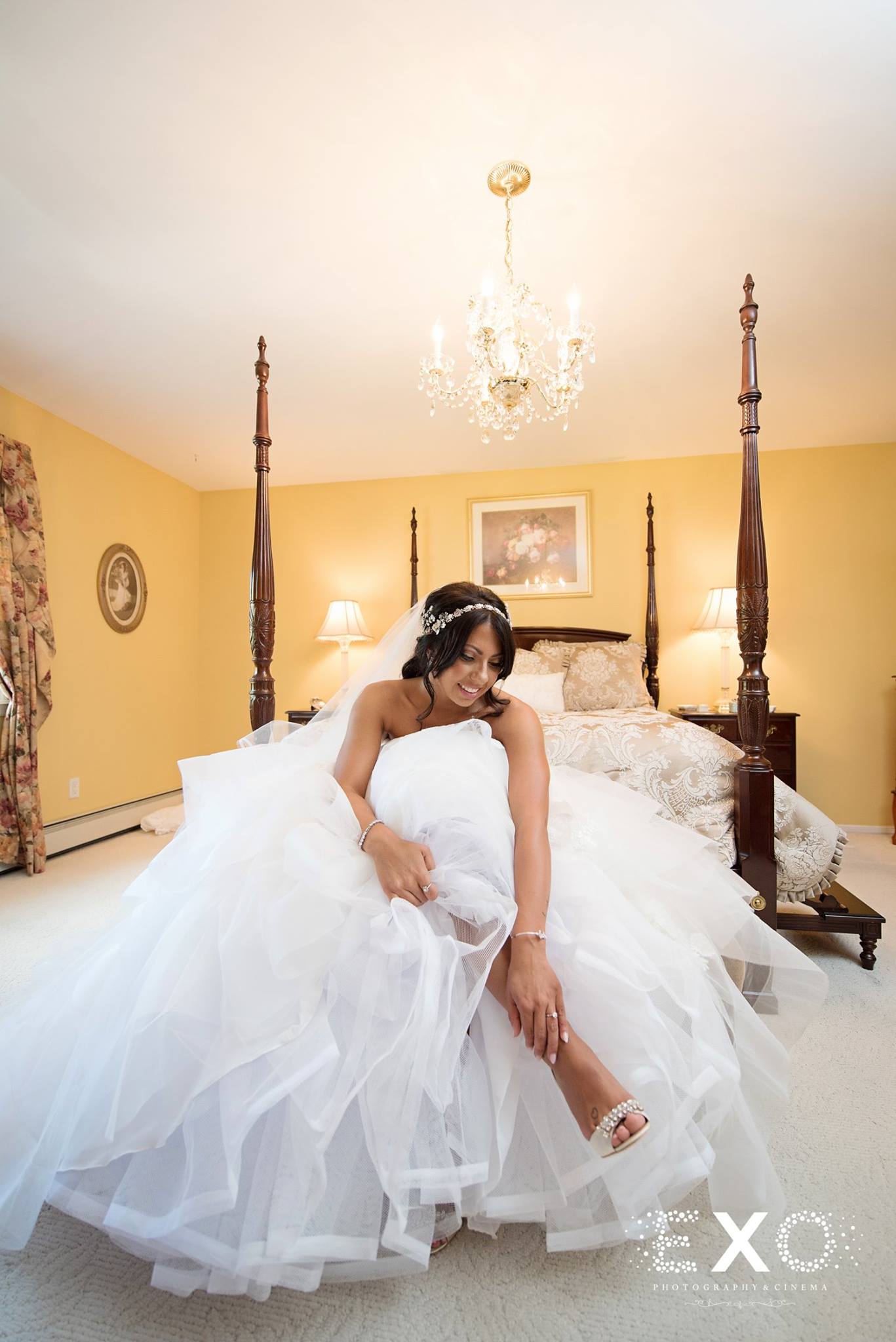 bride getting ready in her gown by the wedding salon of manhasset