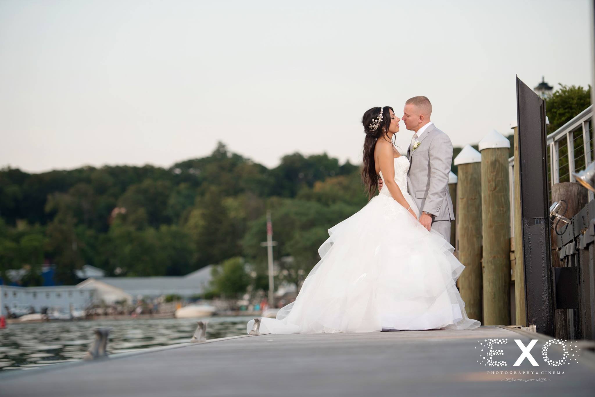 bride and groom together on dock by the bay
