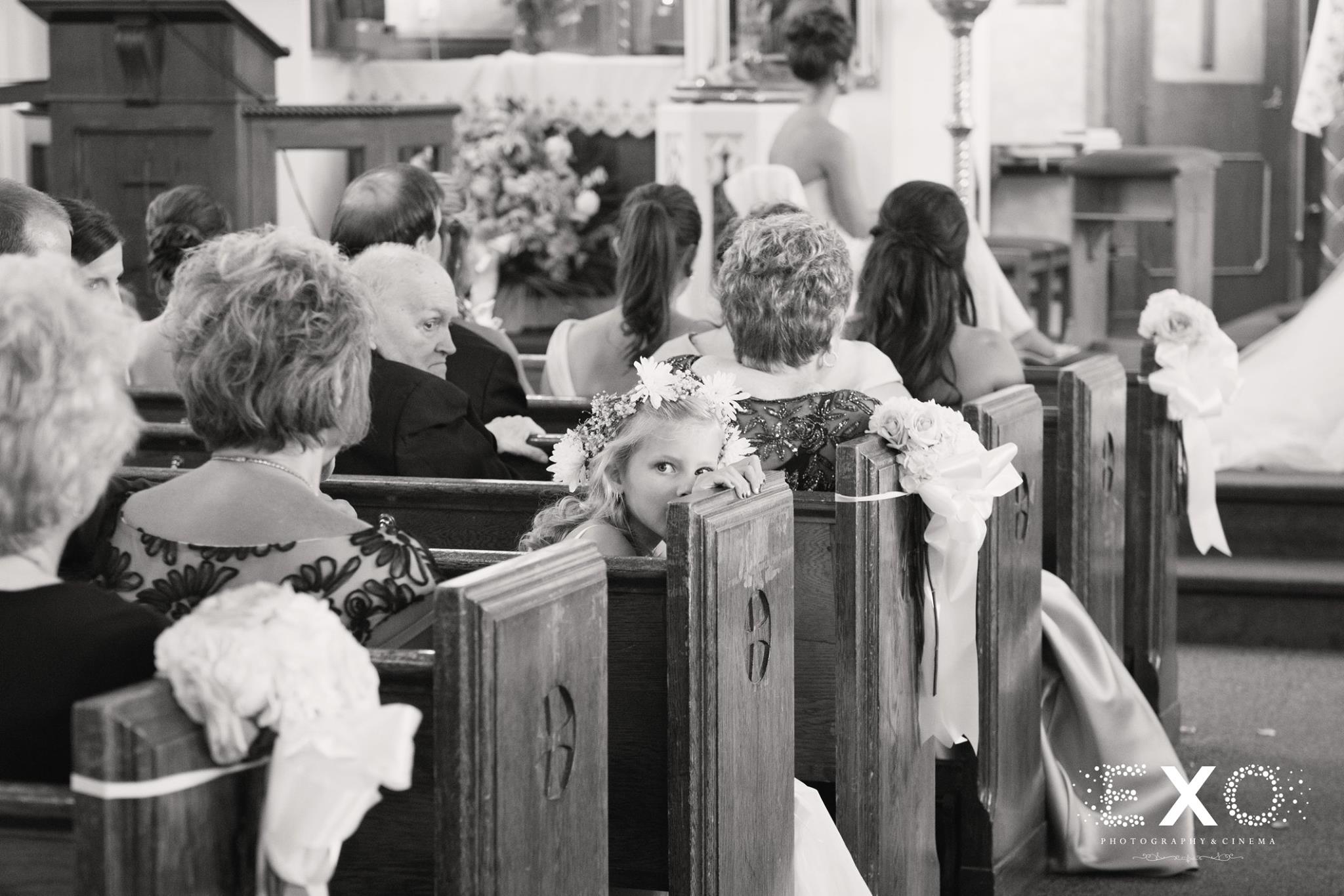 black and white image of wedding aisle with florals by dalsimer, spitz, and peck