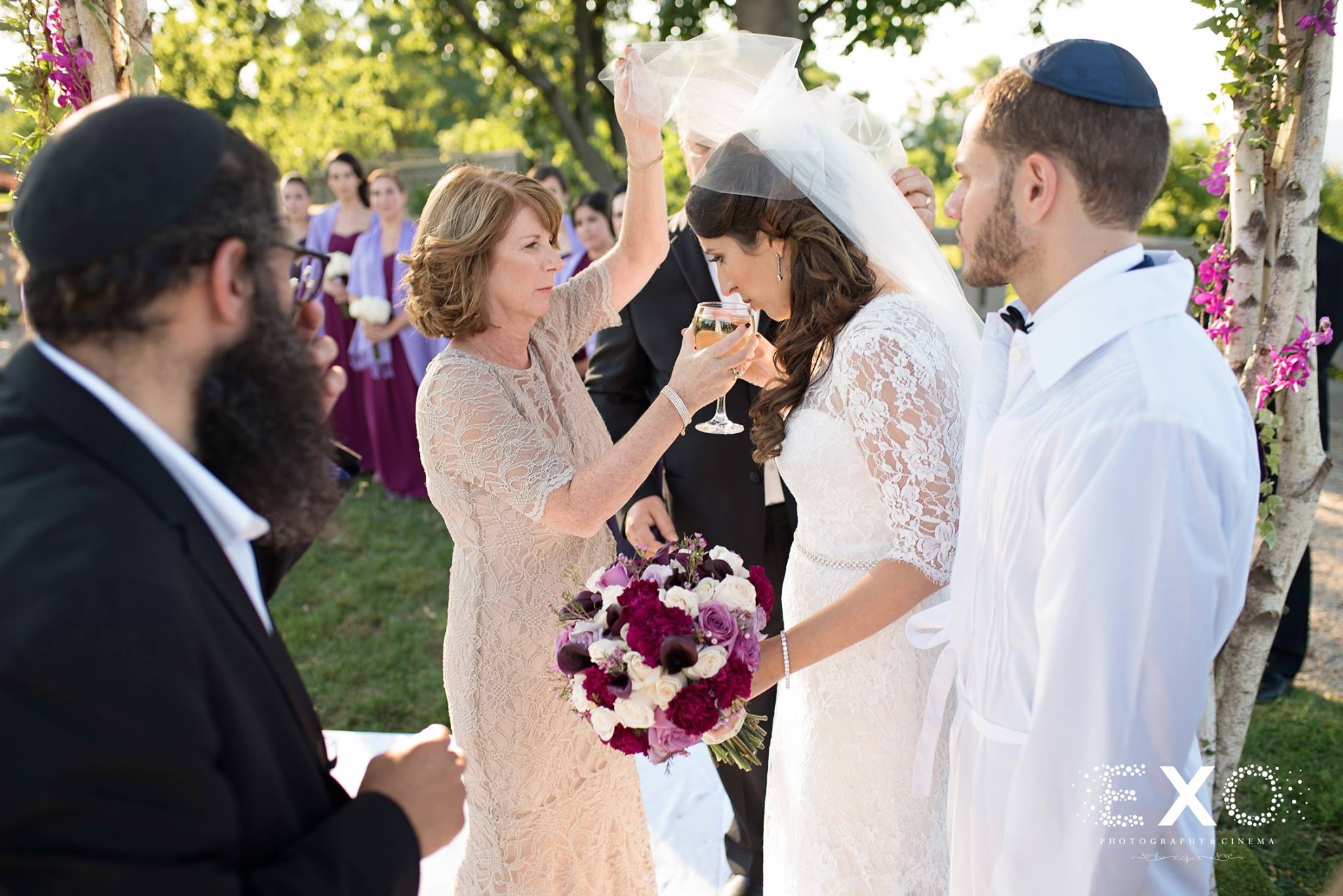 bride drinking wine during jewish wedding ceremony at Hempstead House