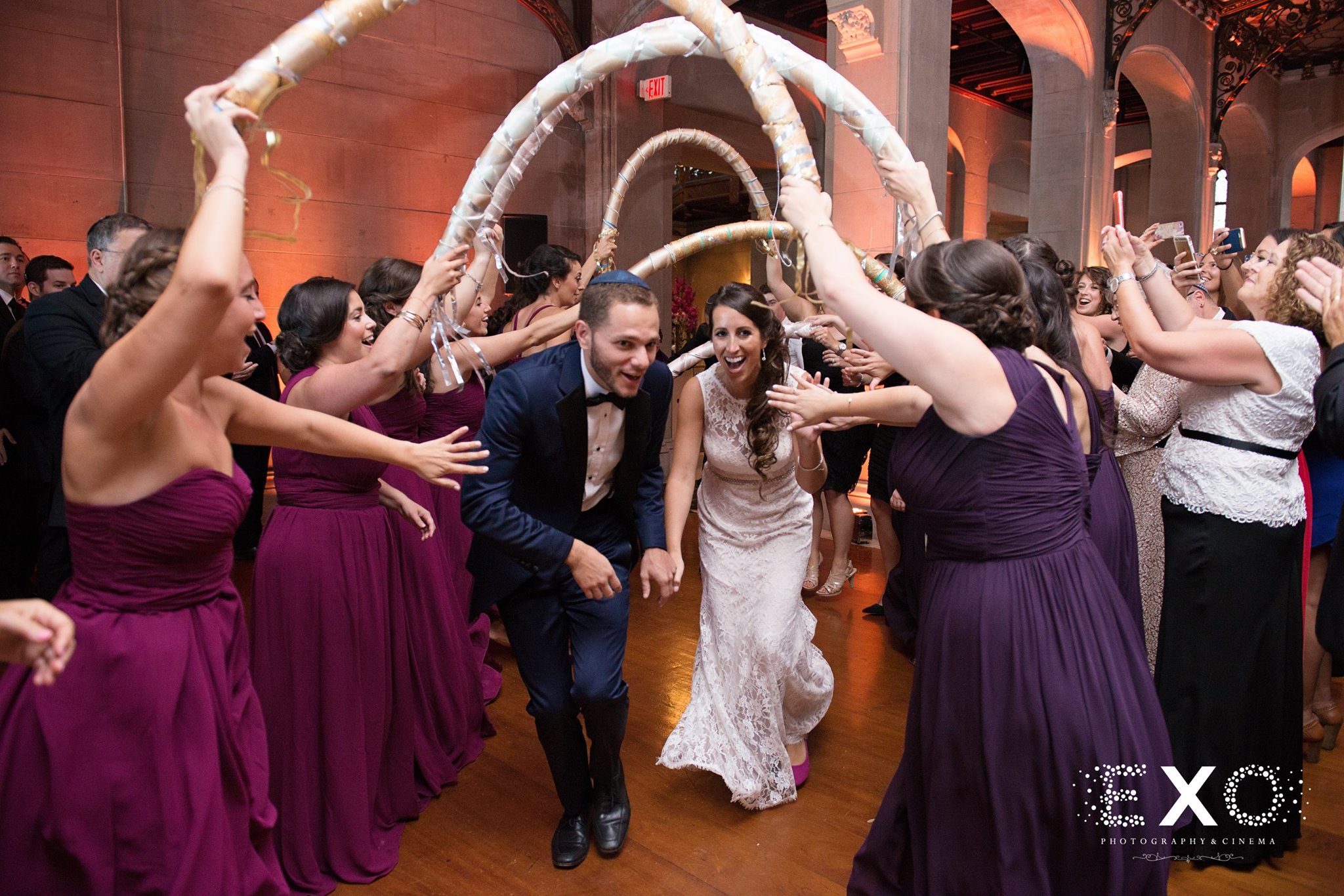 bride and groom dancing with wedding party during reception at Hempstead House