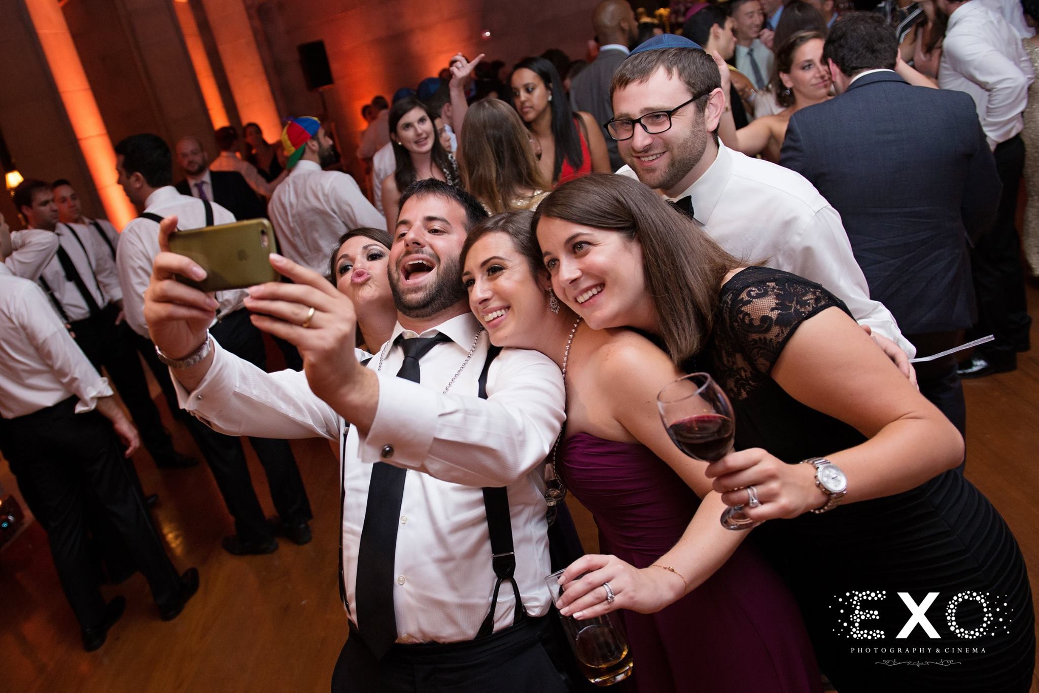 wedding guests taking selfie