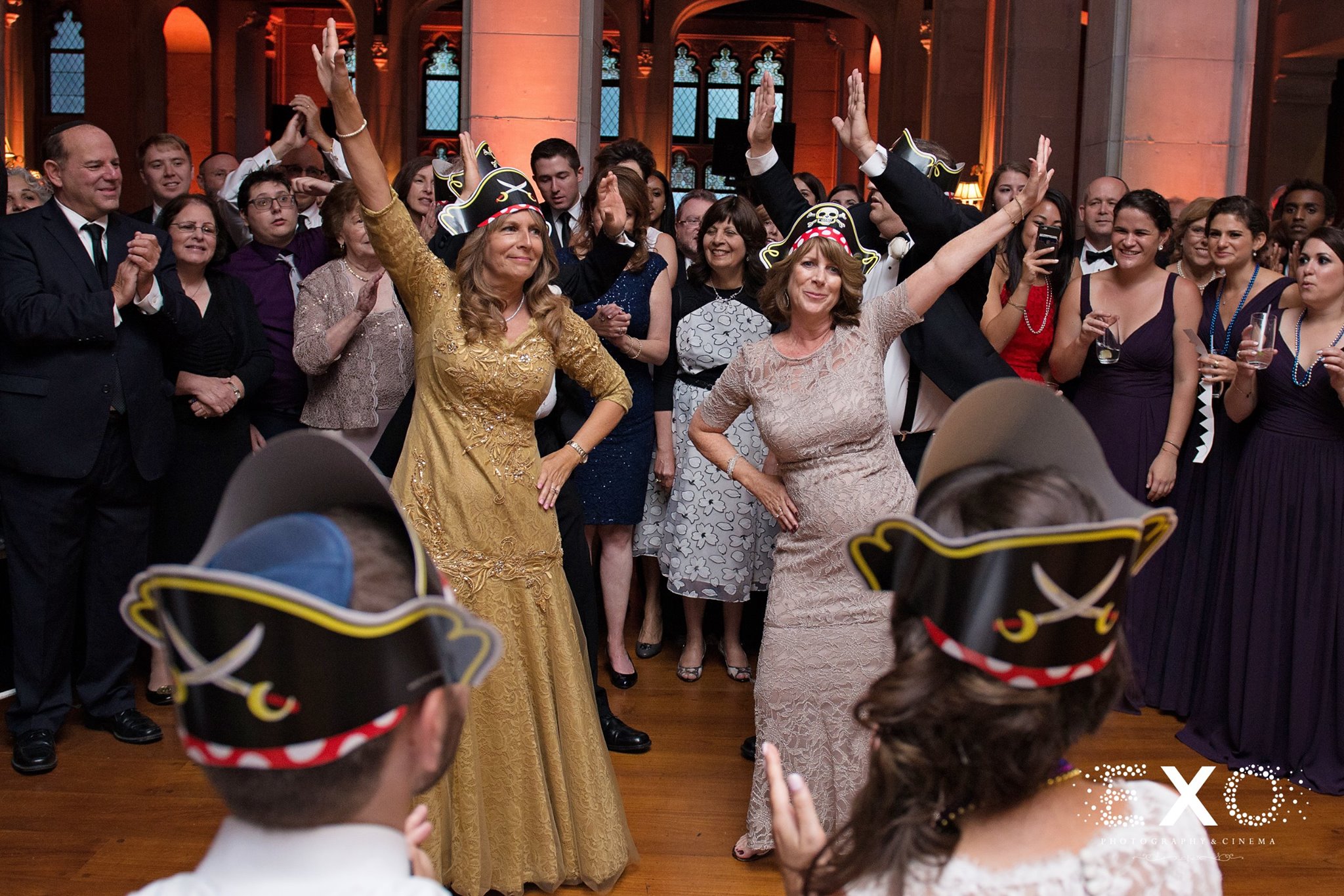 mothers of the bride and groom dancing at reception