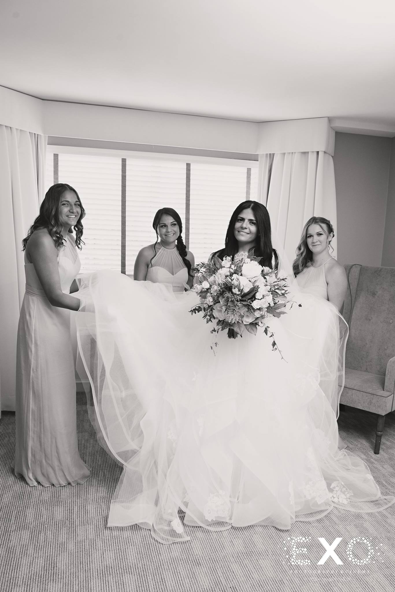 bride and bridesmaids in black and white shot