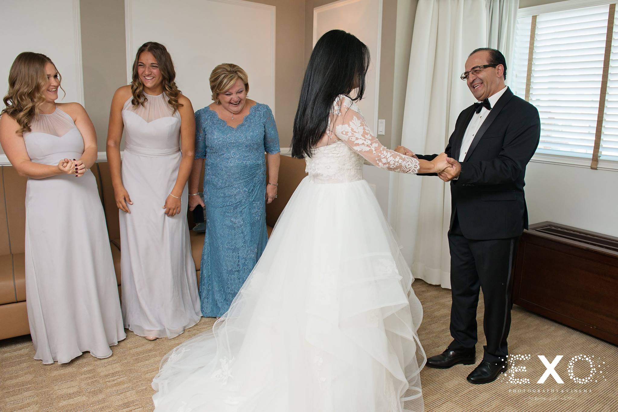 brides father holding annalisa's hands