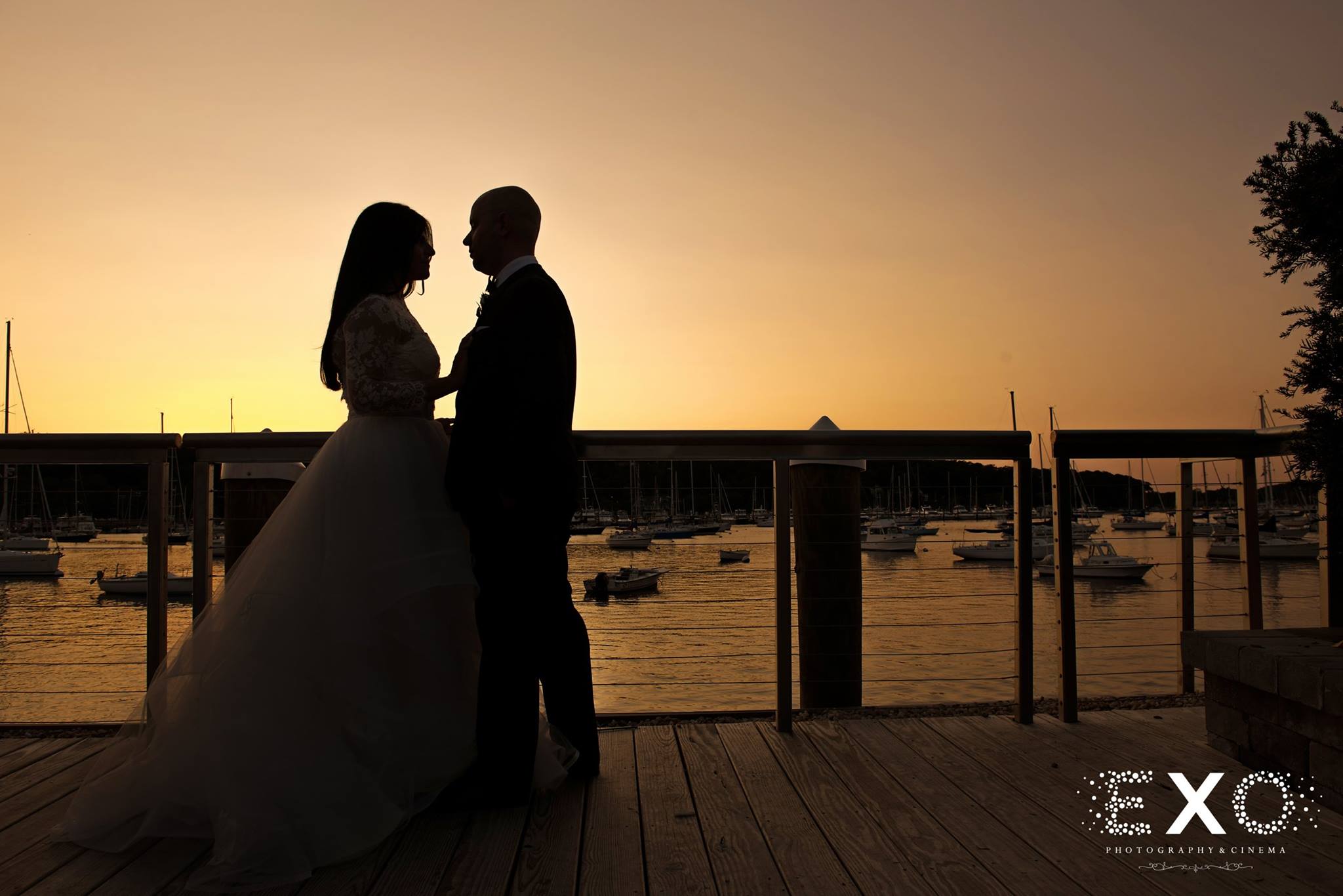 sunset silhouette picture of bride and groom