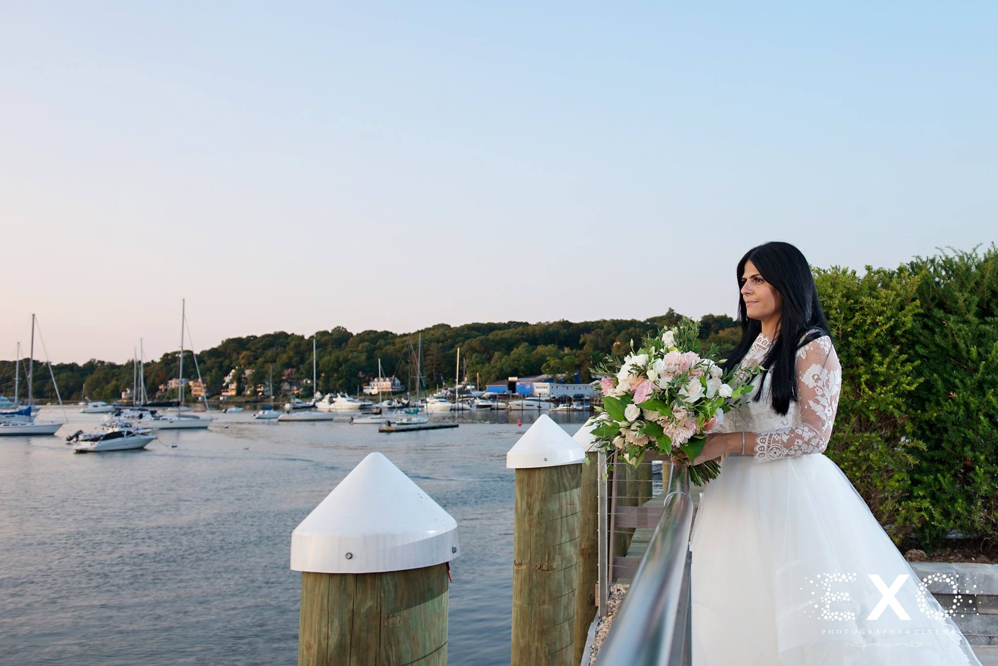 annalisa with bouquet by andrew pascoe flowers by water at Harbor Club at Prime