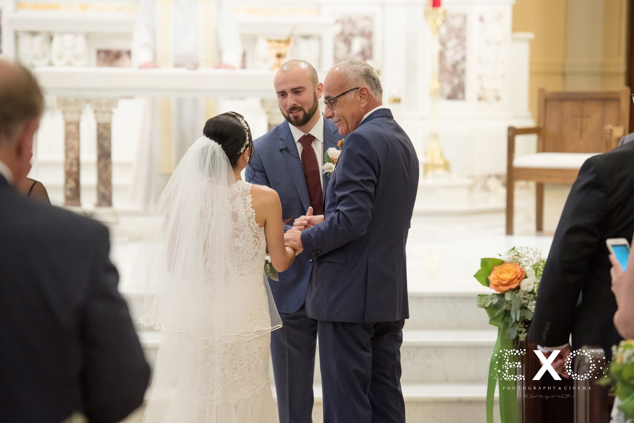 groom looking at bride at altar 