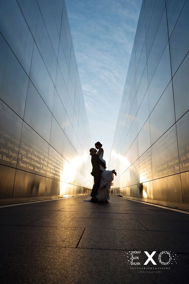low perspective shot of bride and groom in silhouette shot