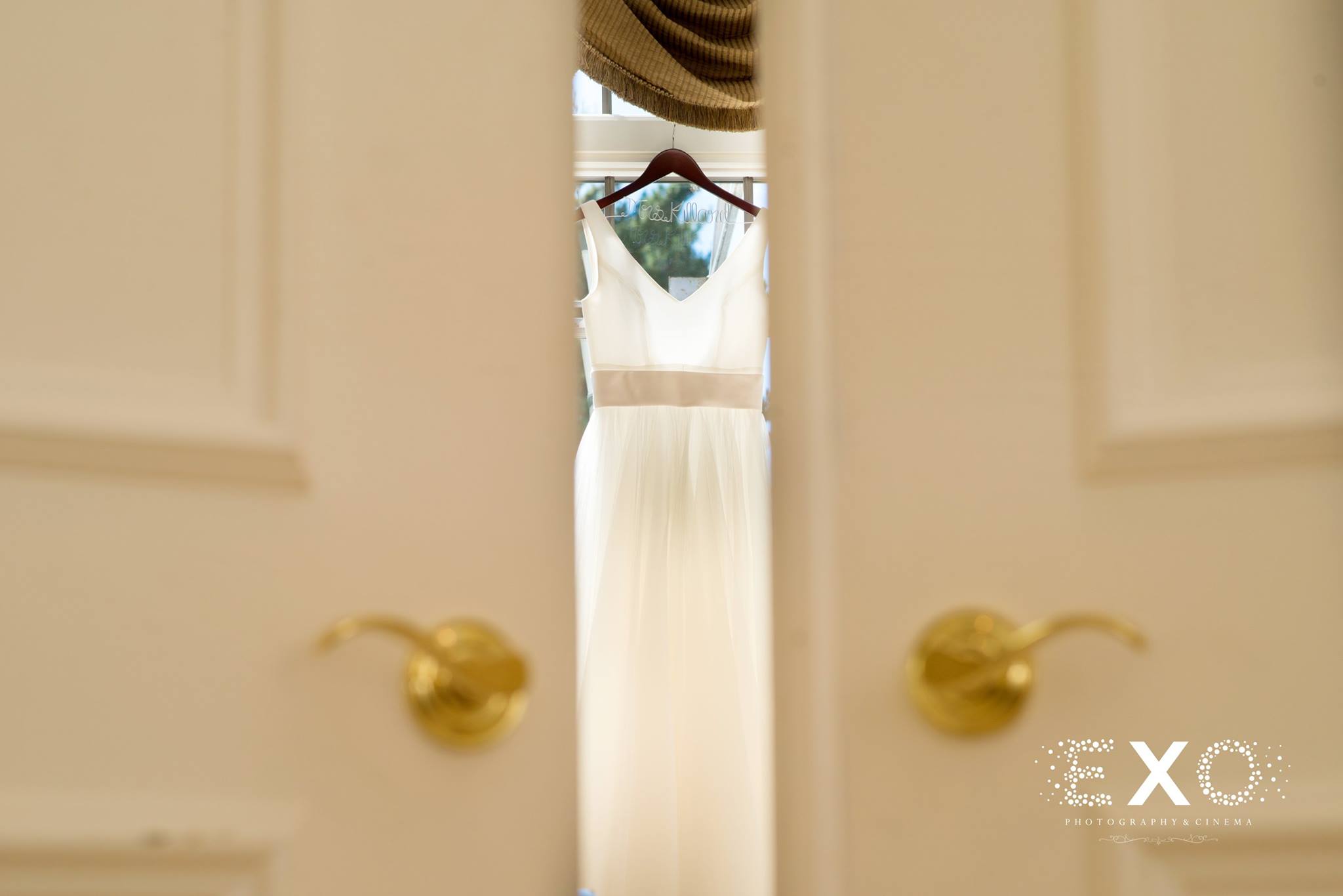 BHLDN wedding gown designed by Theia between doors