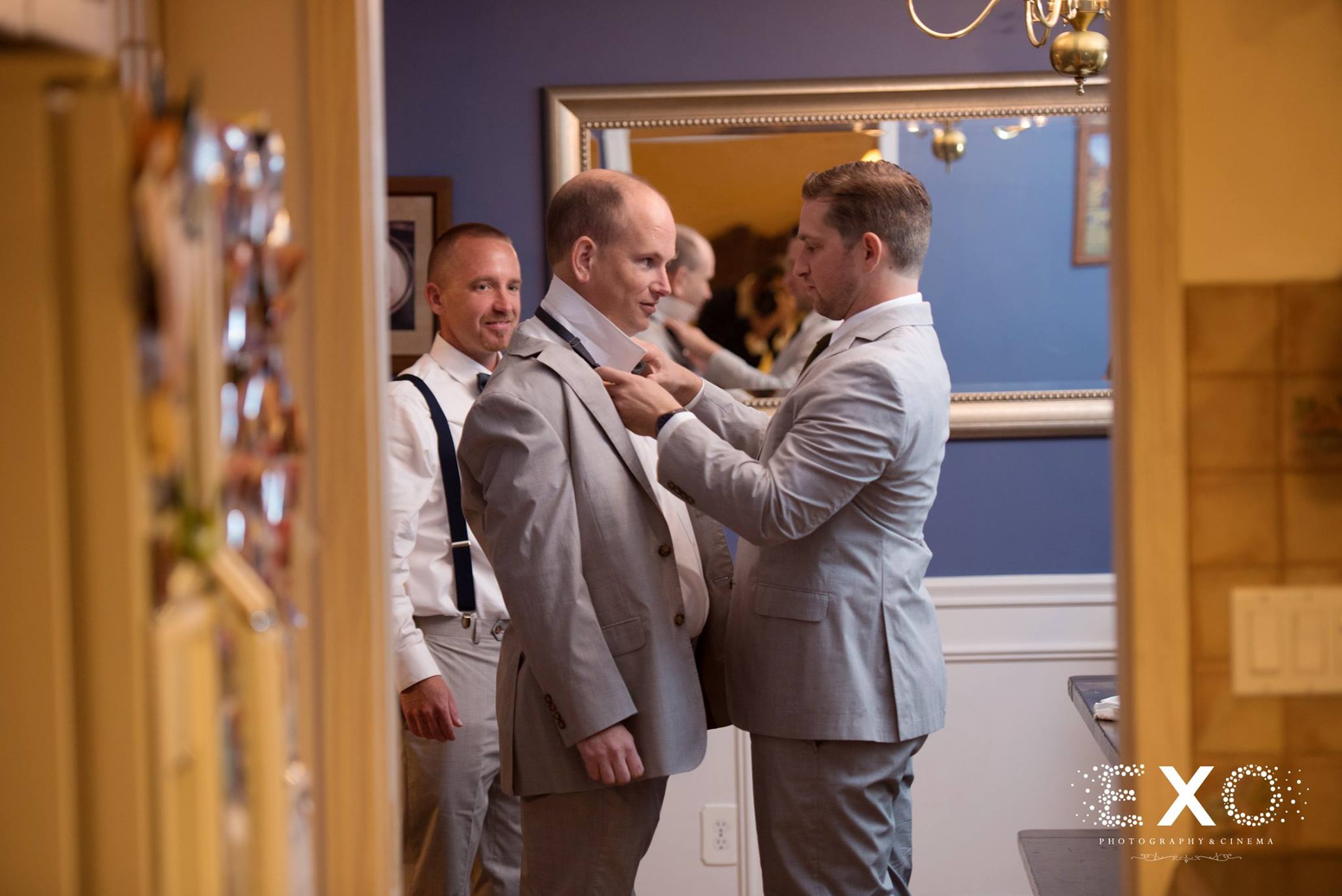 groom and groomsmen getting ready