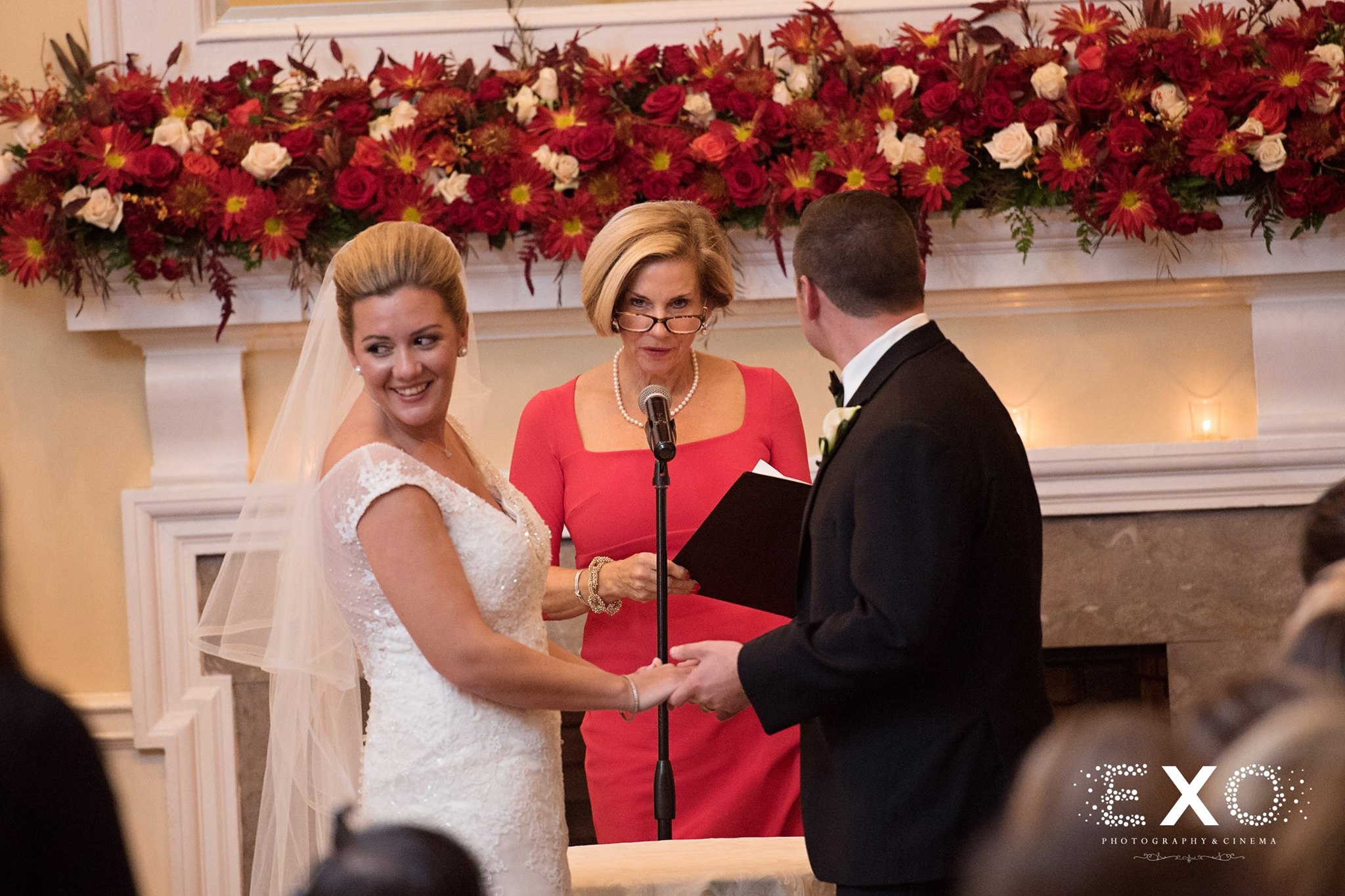 bride and groom at altar with reverand sarah gutmann during ceremony