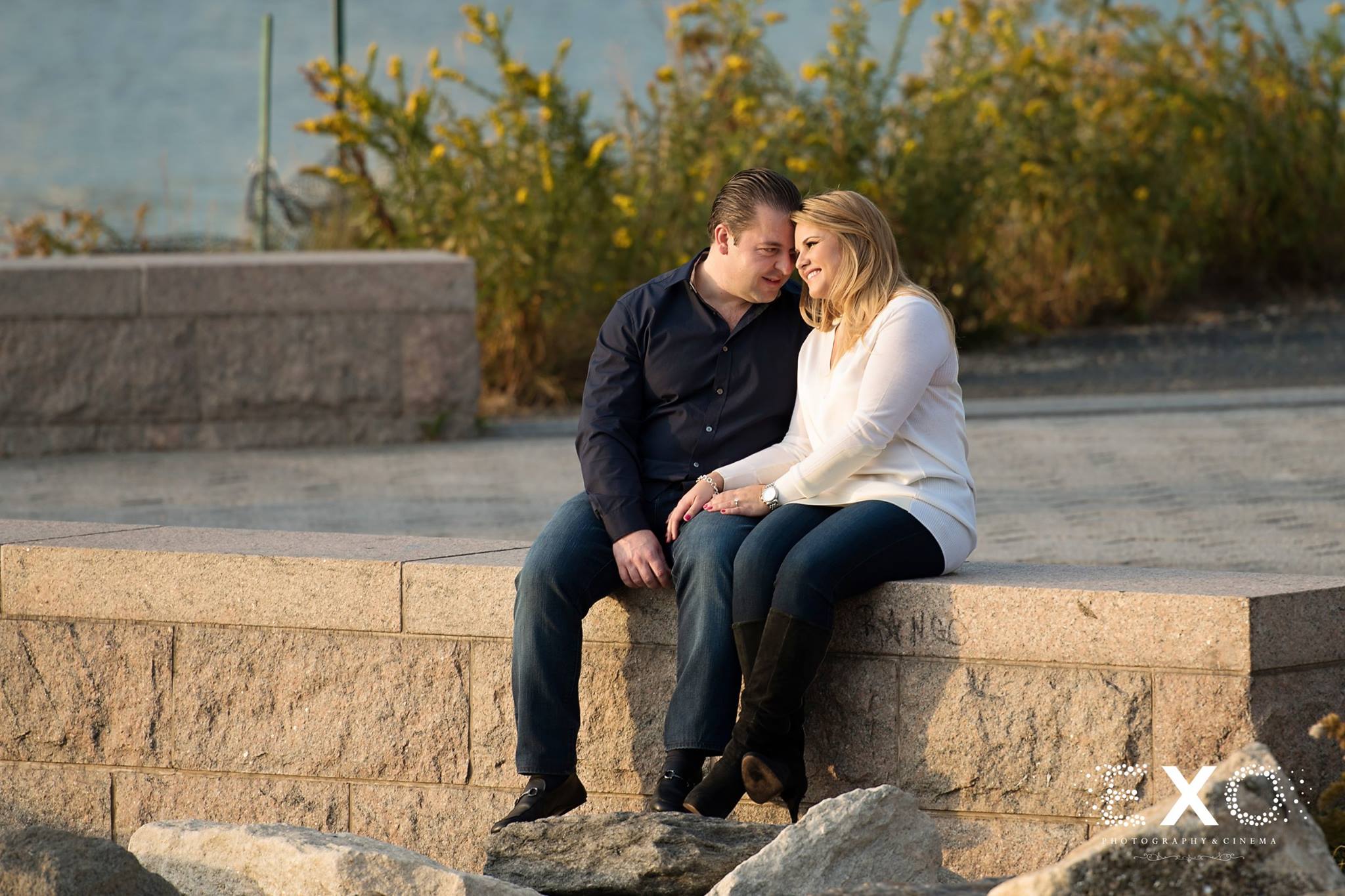couple sitting on ledge near Gantry Park