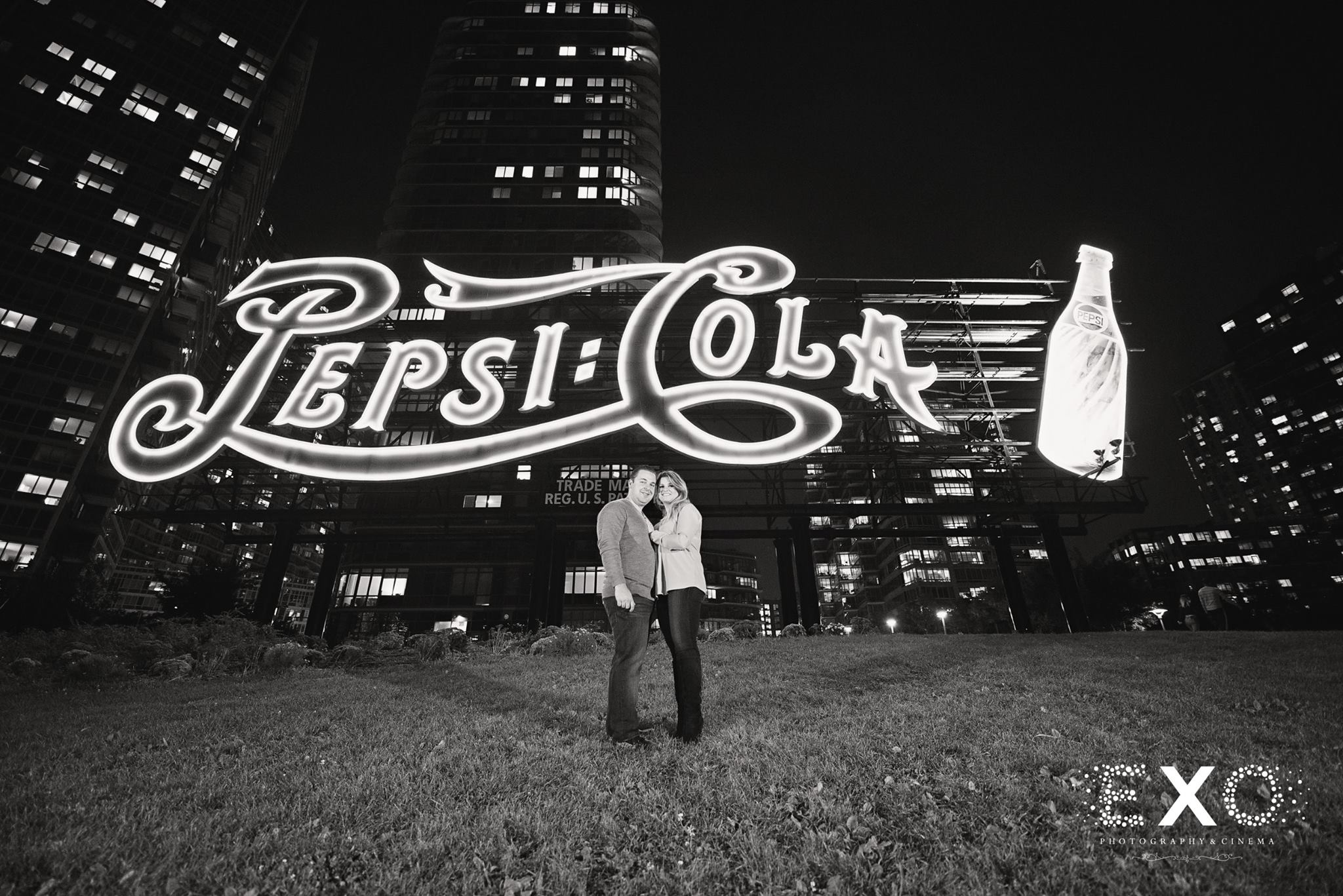 monica and lou in front of pepsi cola sign near Gantry Park