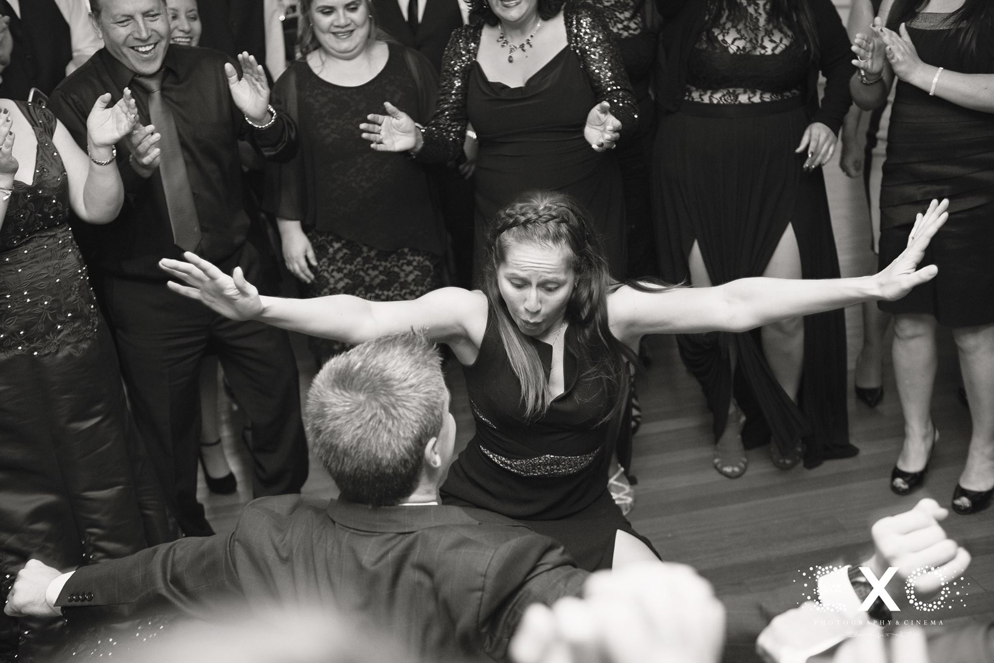 black and white image of guests dancing to barattini productions at Watermill Caterers wedding