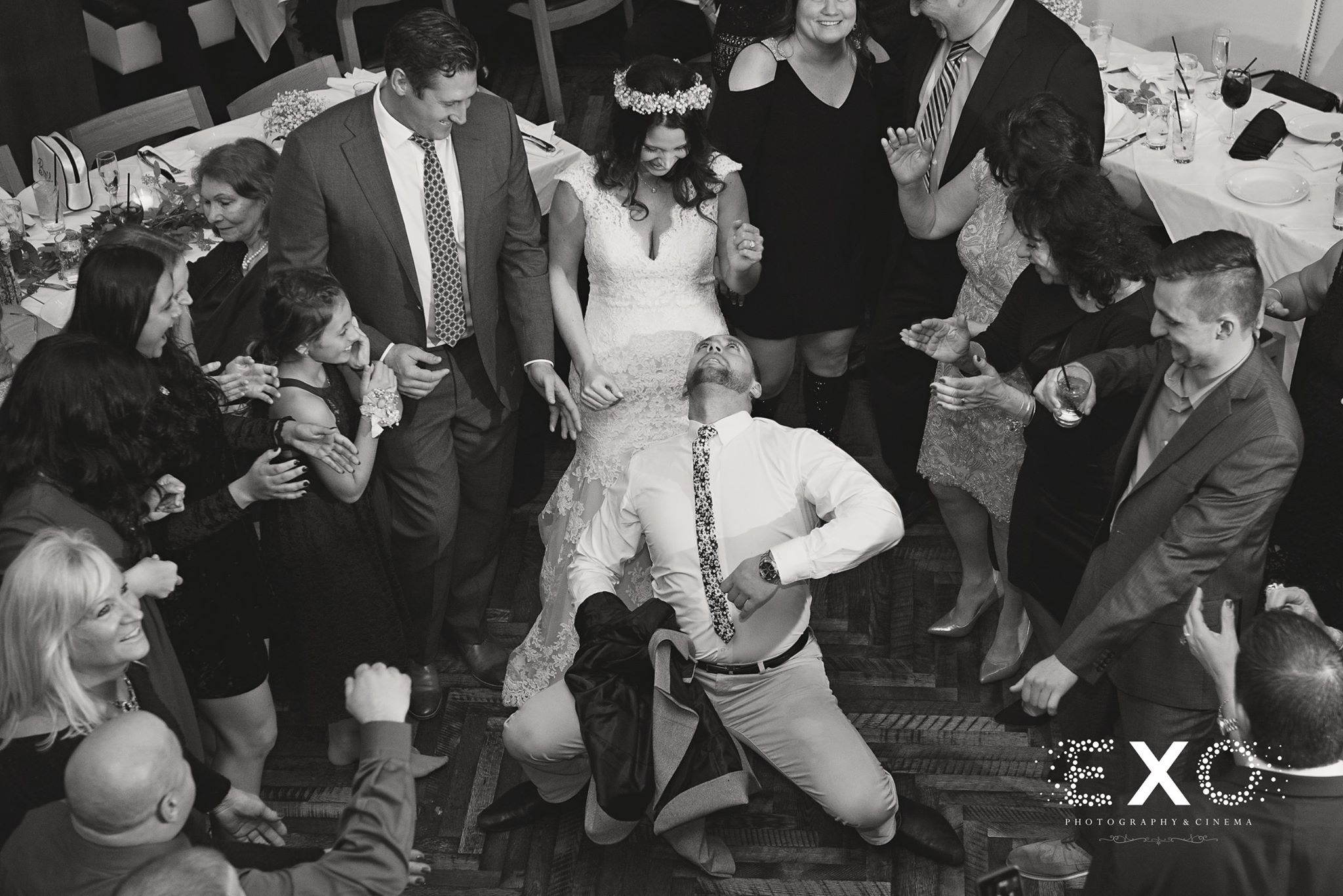 black and white image of wedding guests dancing to music by press play events