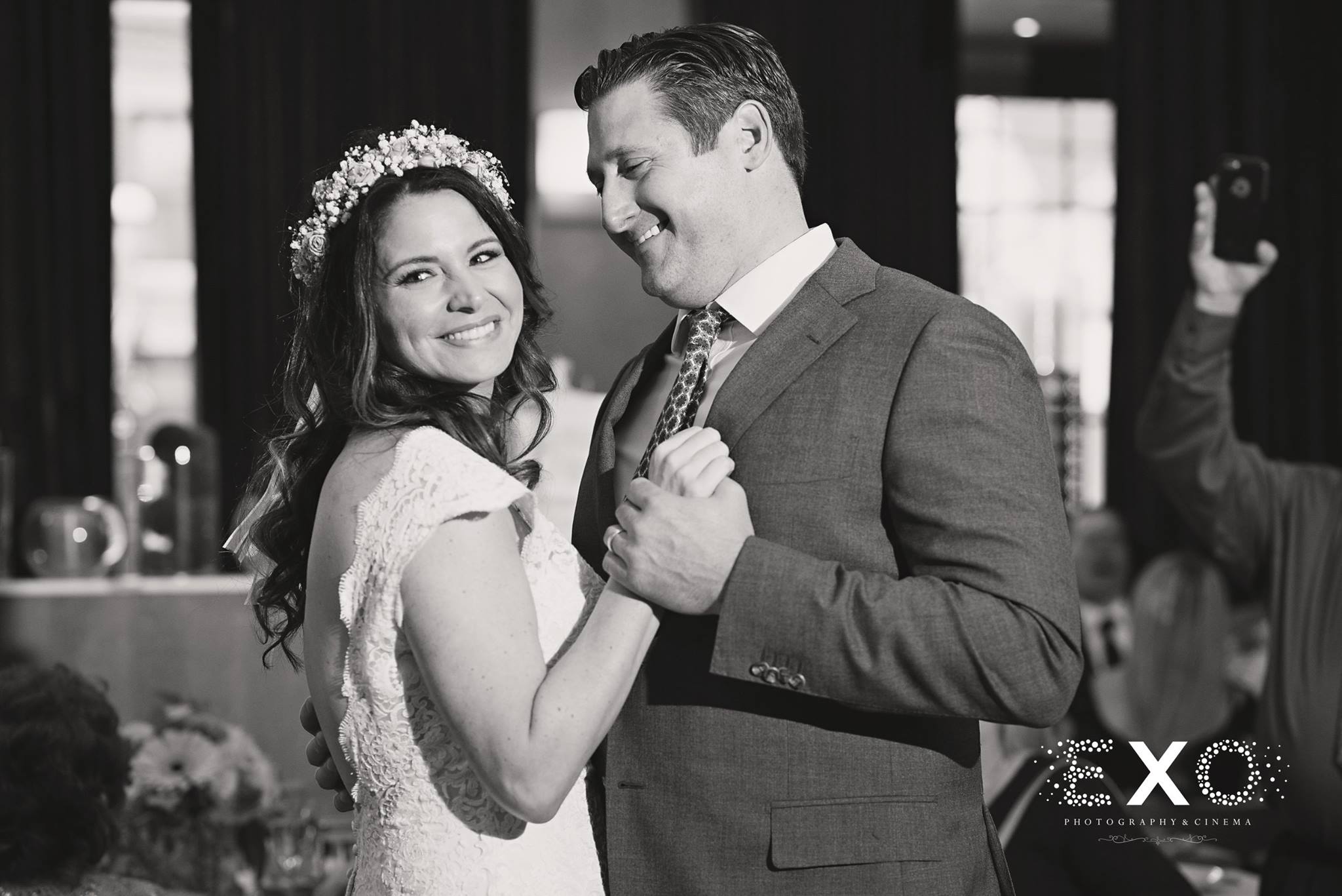 black and white image of bride and groom dancing to music by press play events 