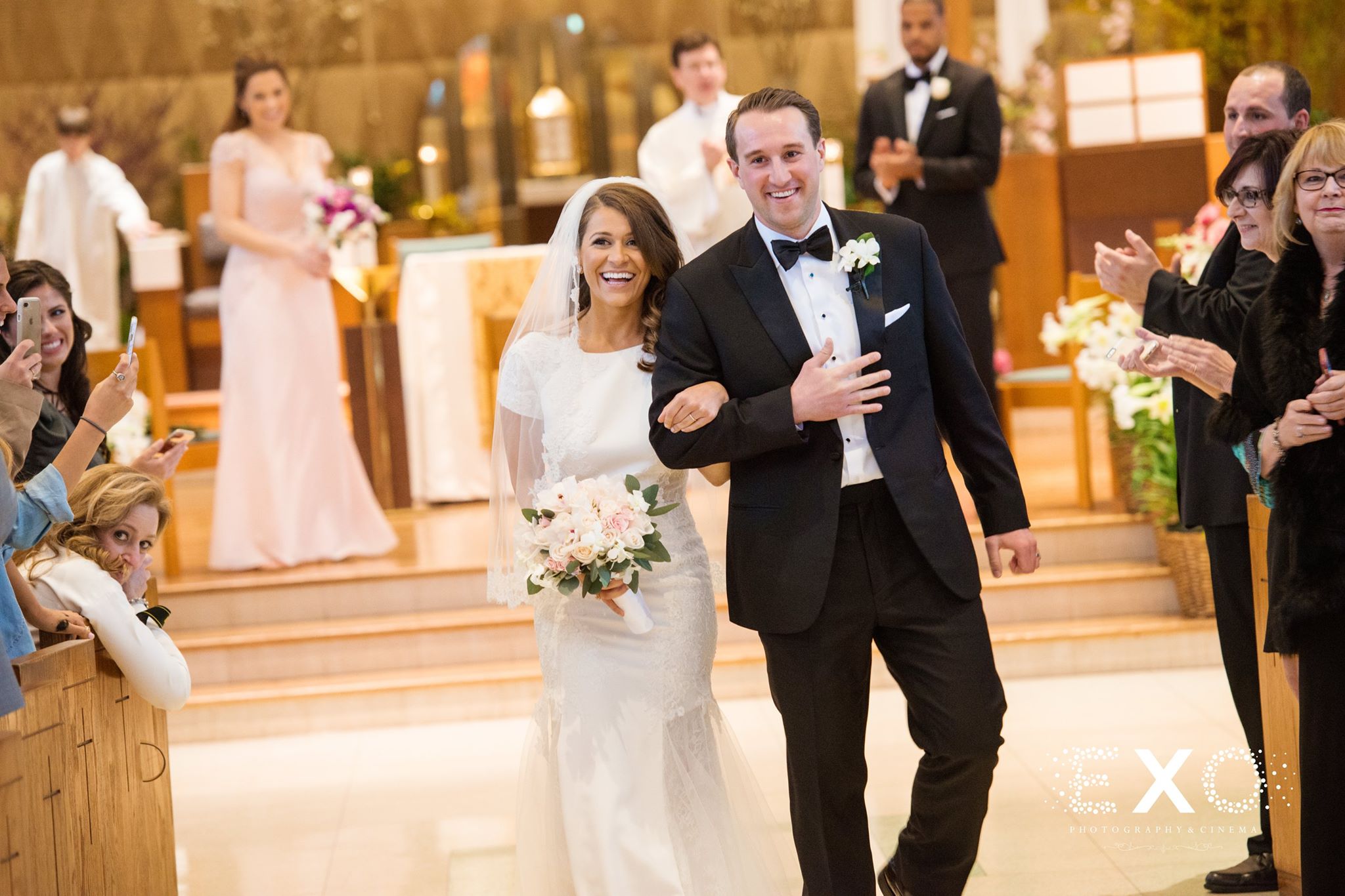 bride and groom walking down aisle 
