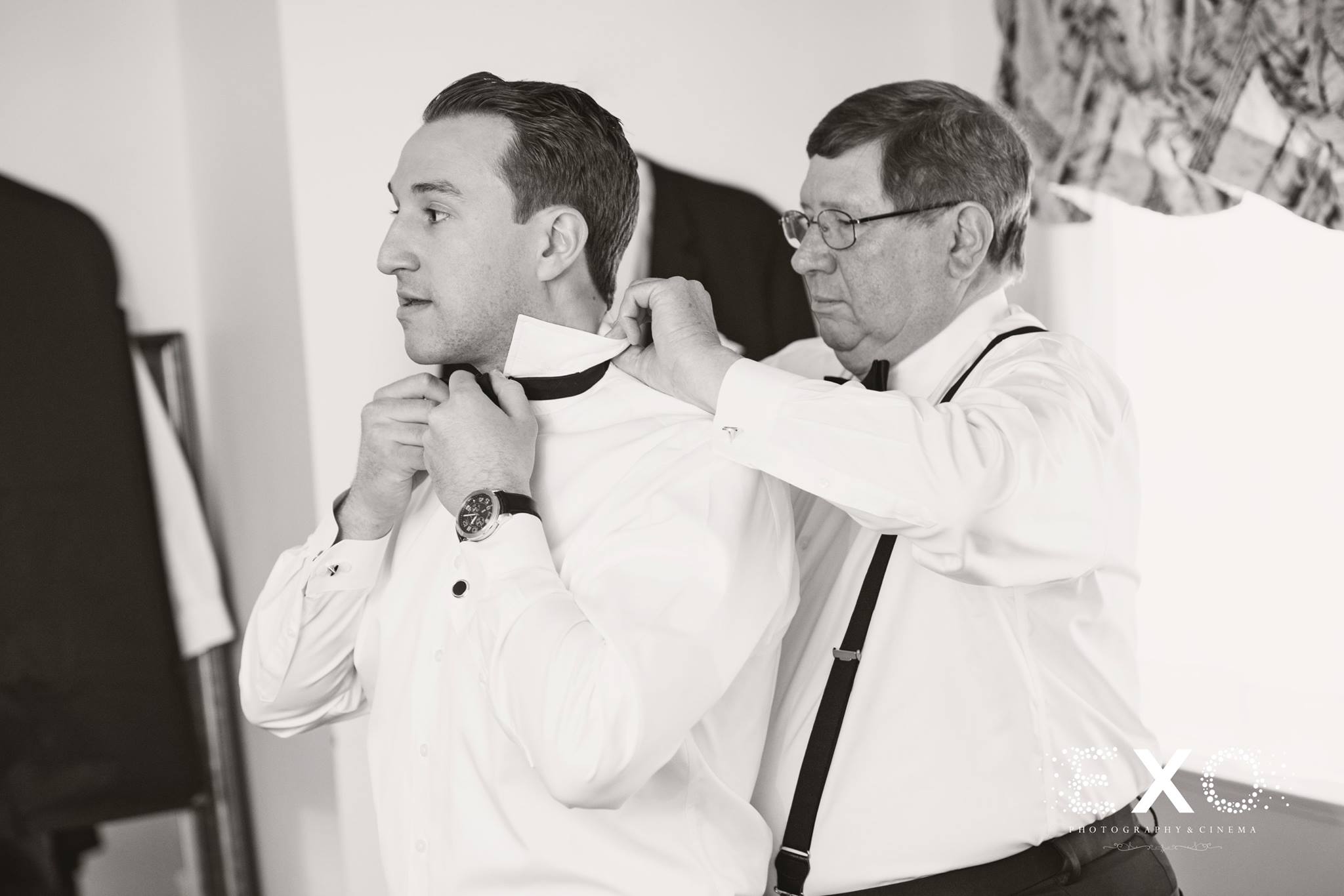 groomsmen and fathers preparing for ceremony