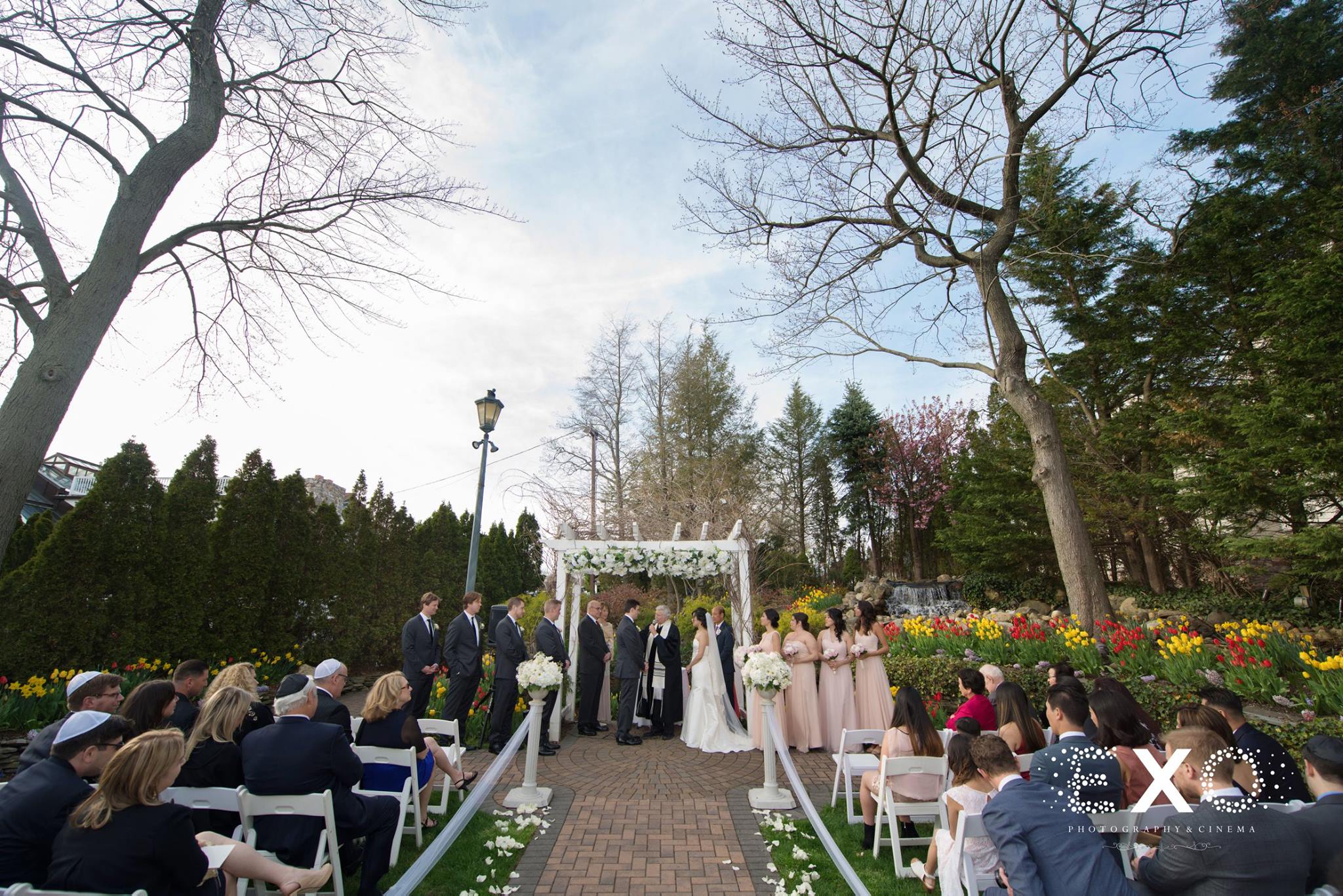 perspective shot down the aisle of bride and groom during Fox Hollow ceremony