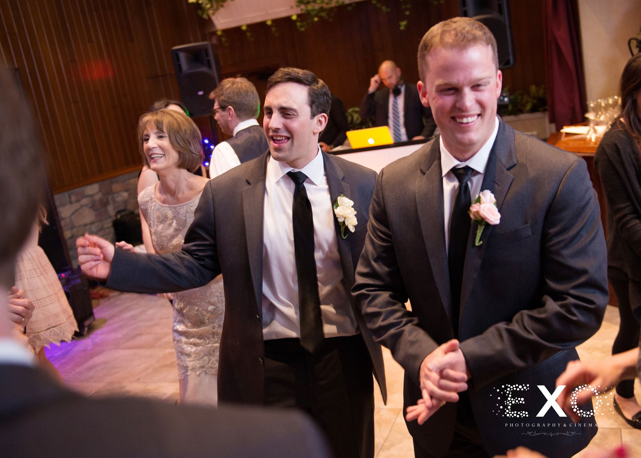 Groom and wedding guests dancing to music by Variety Music