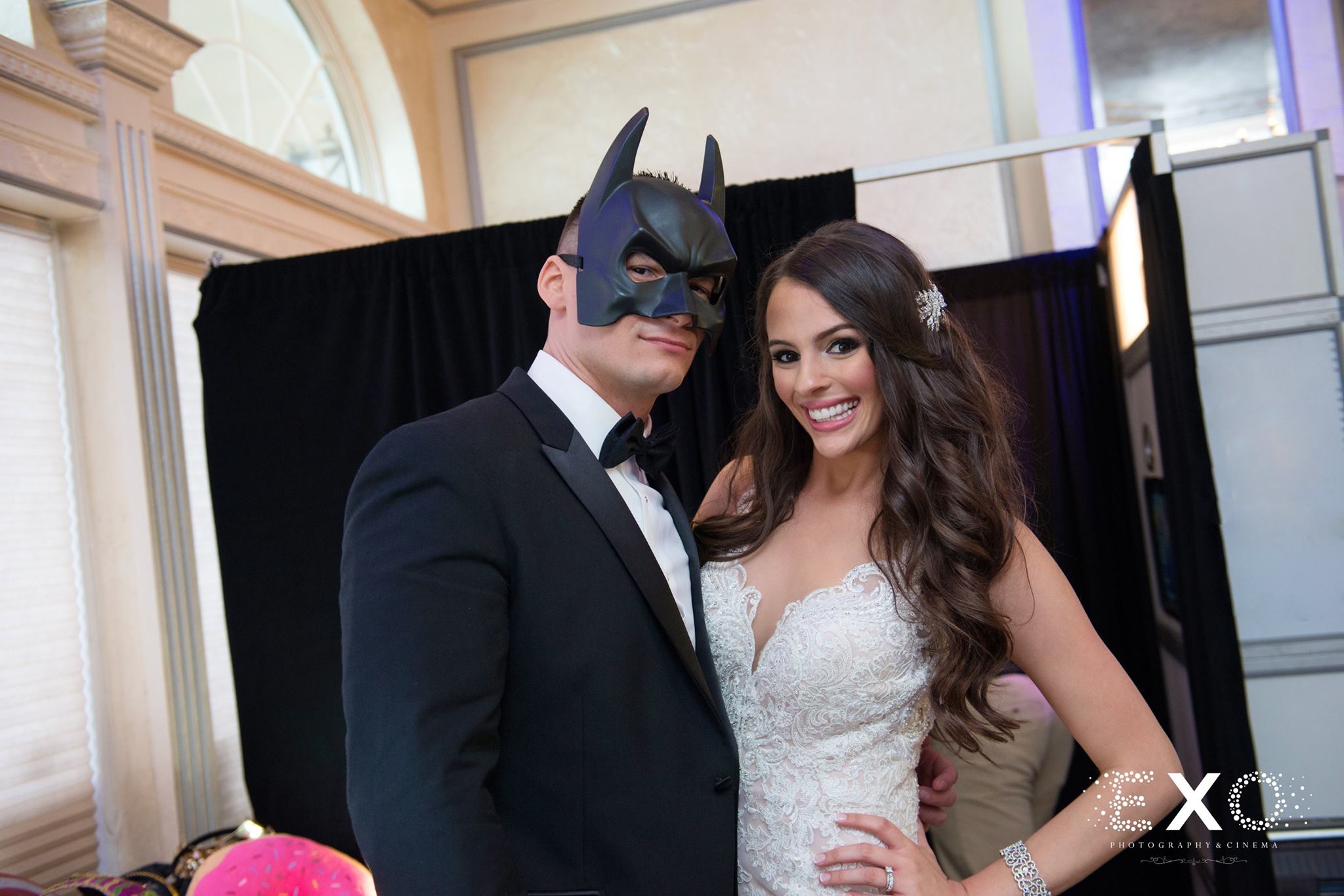groom wearing a batman mask