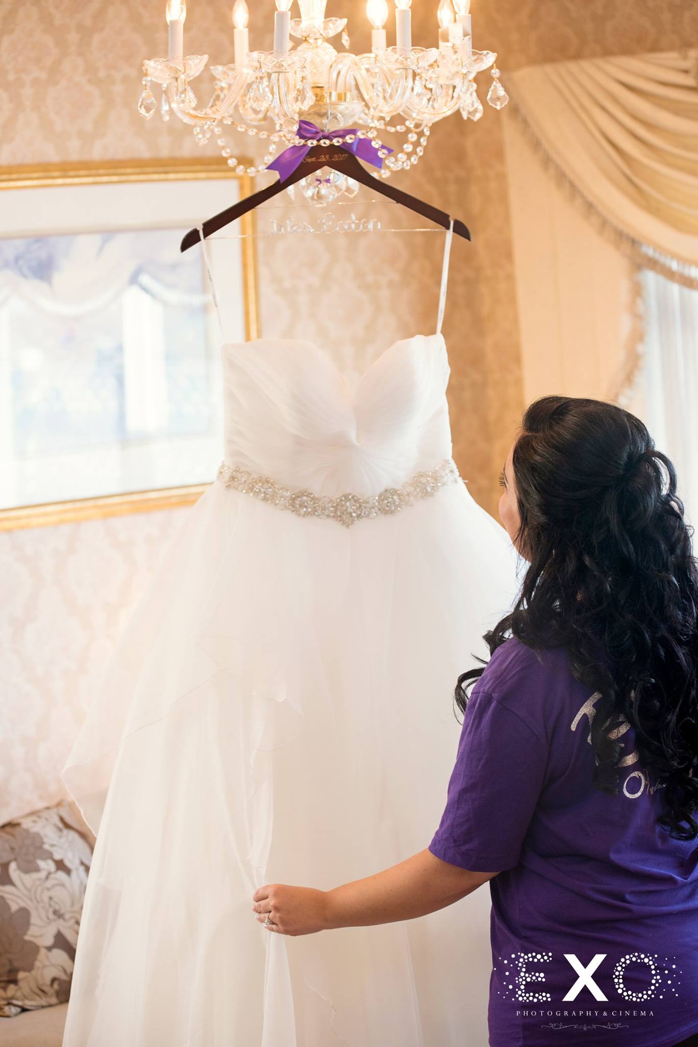 bride touching bridal gown