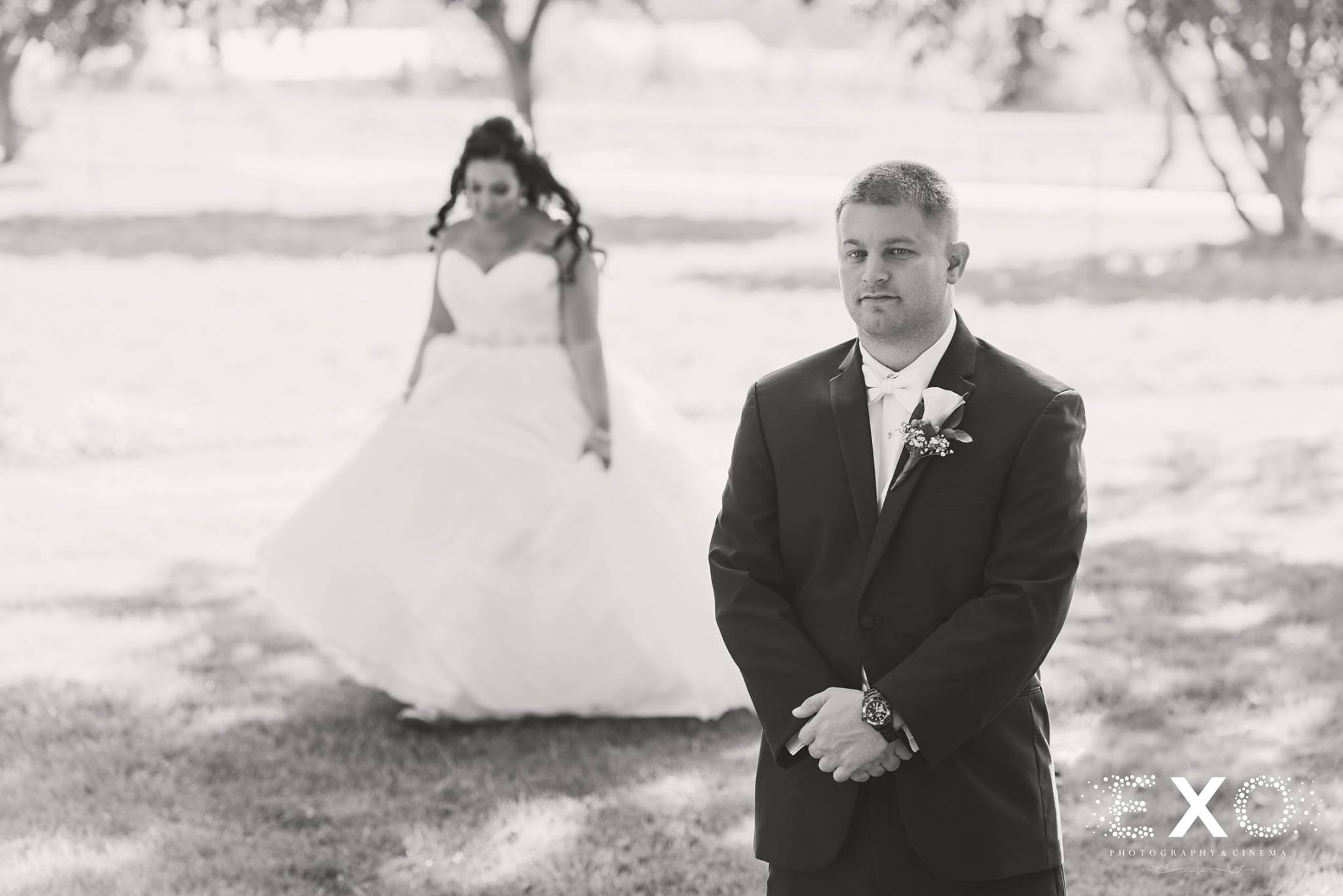 black and white image of groom and bride before first look
