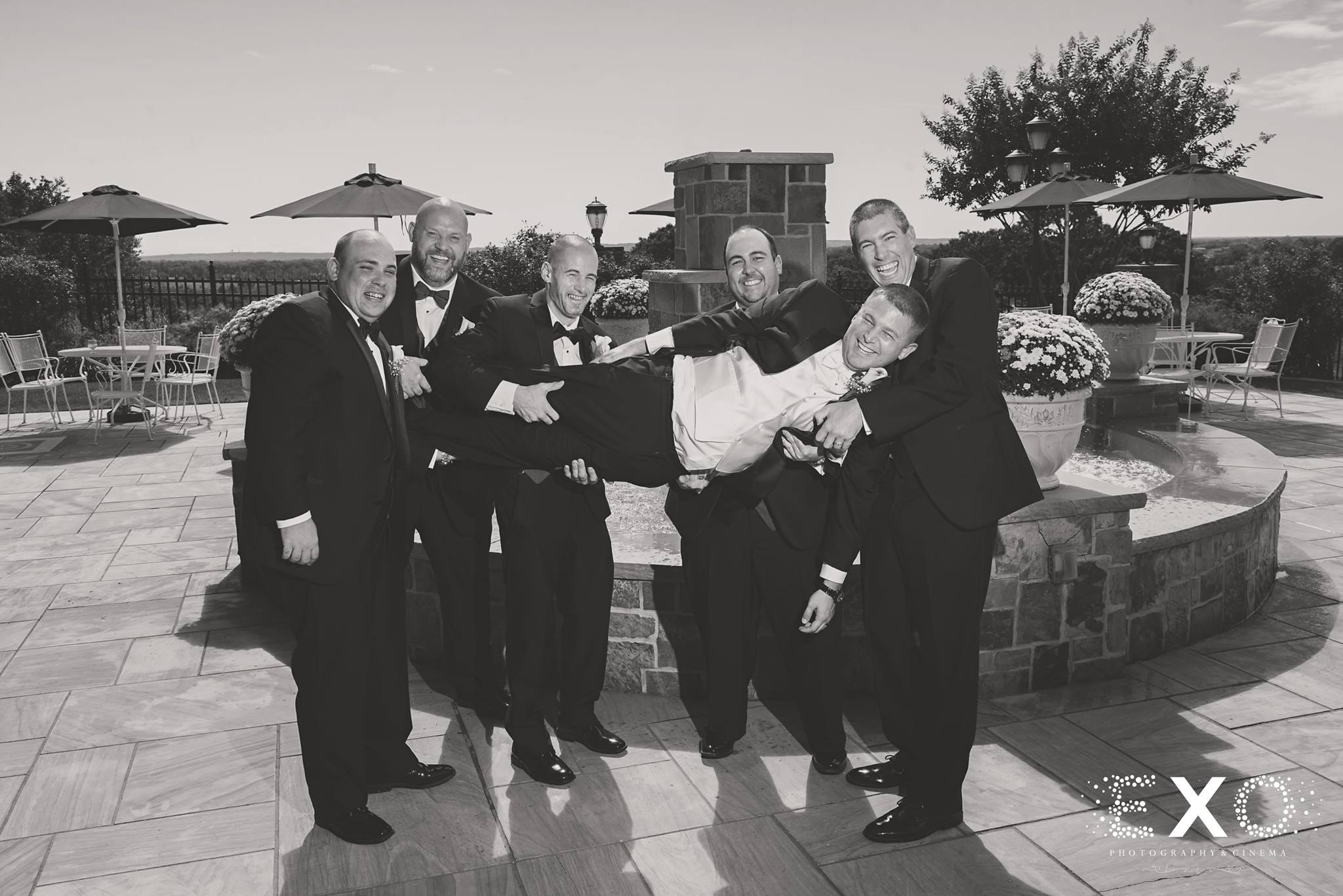 black and white image of groom and groomsmen in Tony Bowls suits