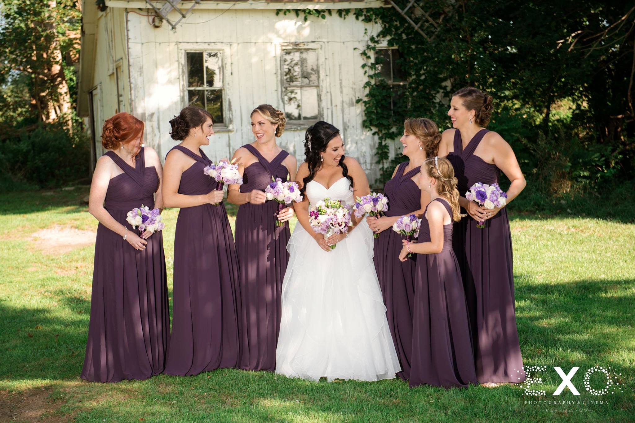 bride wearing Burton Bridals gown and bridesmaids wearing Nordstrom dresses