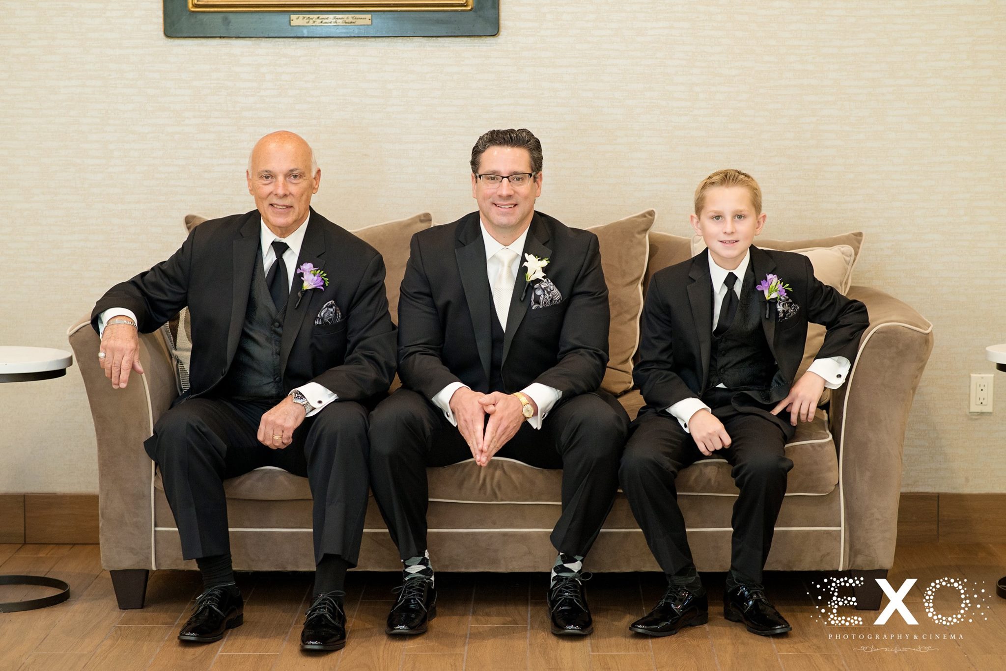 groom and family on couch before wedding ceremony