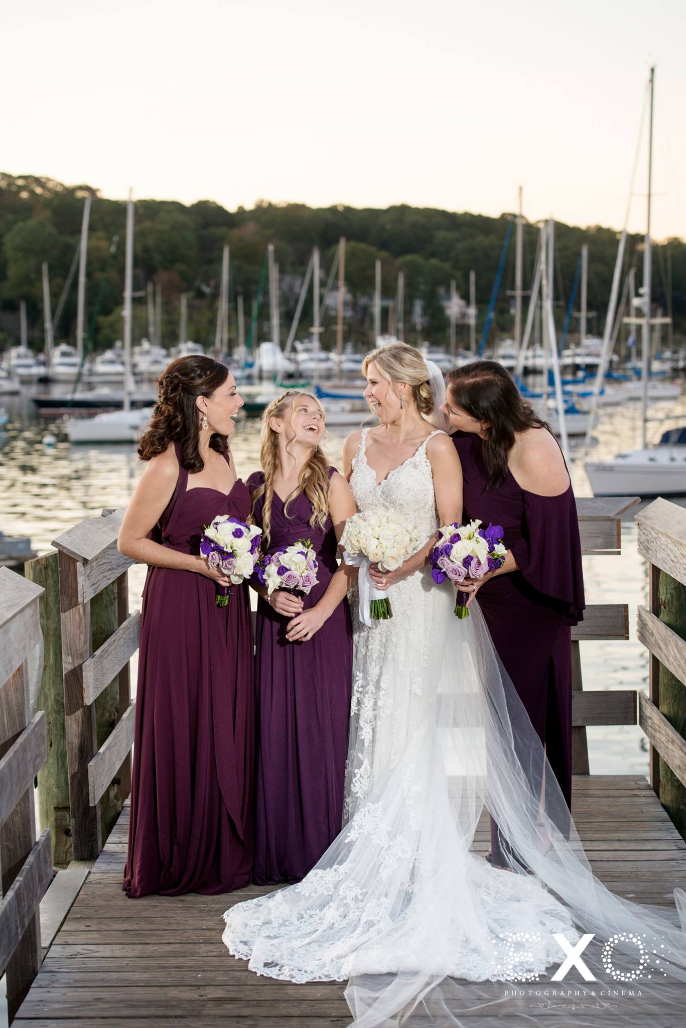 bride and bridesmaids on dock at harbor club at prime