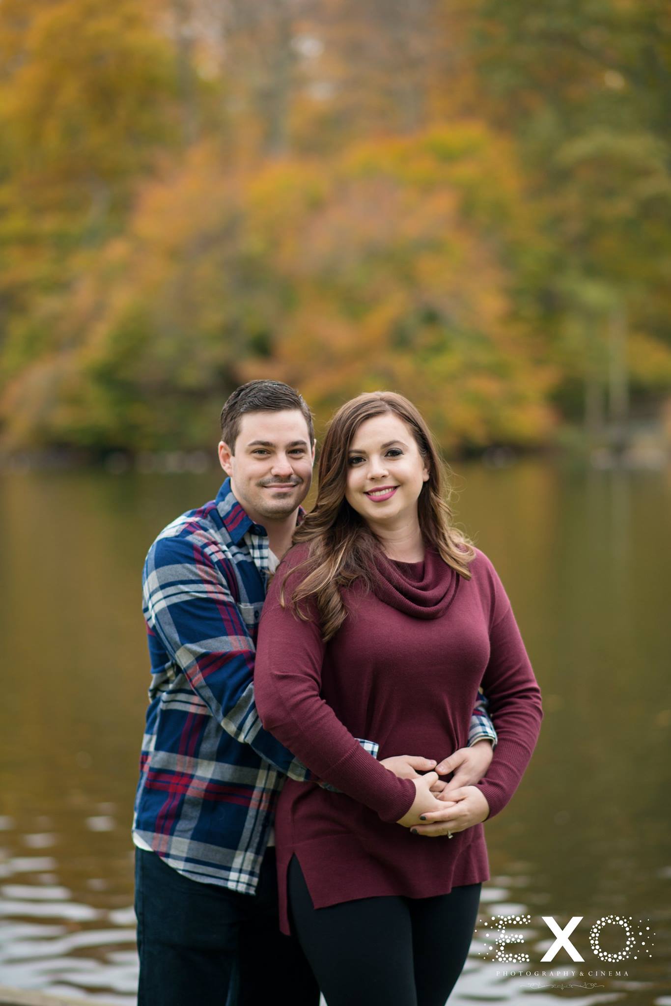 couple by water at Avalon Nature Reserve engagement session