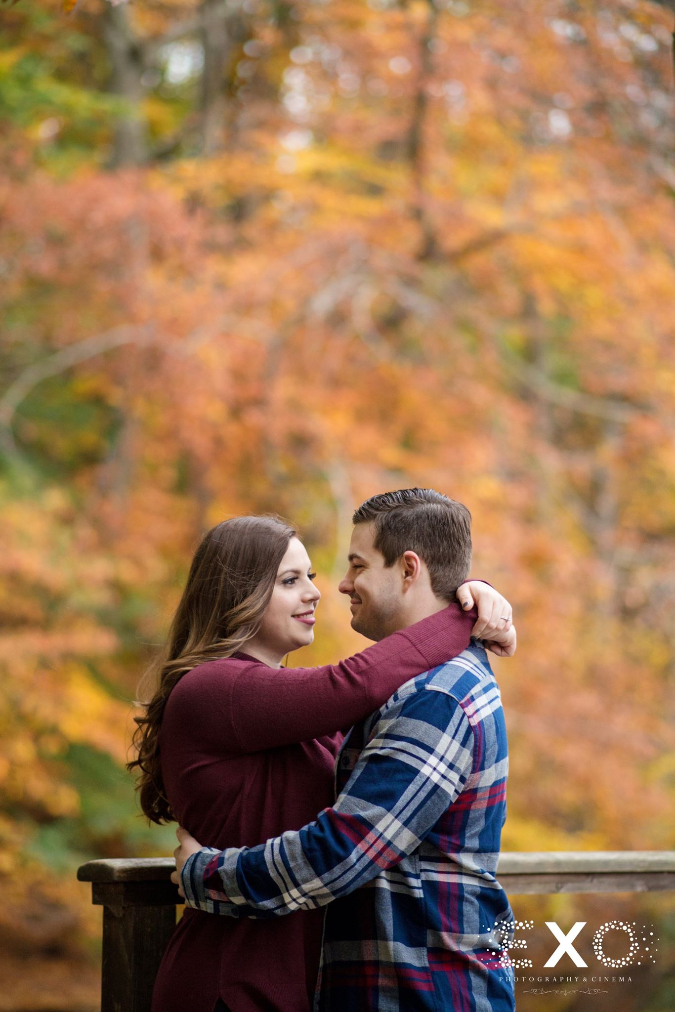 tom and tara holding each other at avalon park engagement session