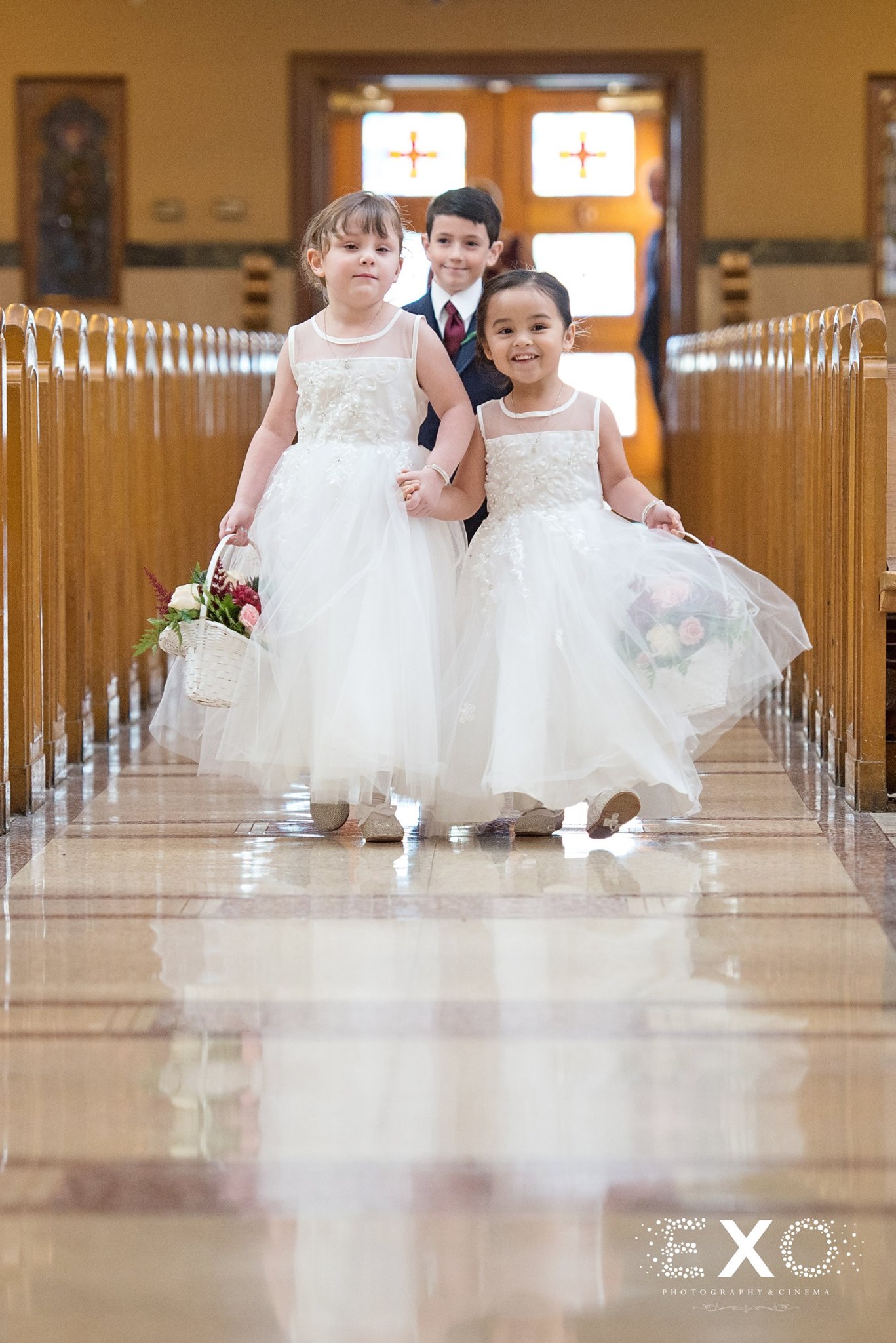 flower girls walking down aisle at Soundview Caterers wedding