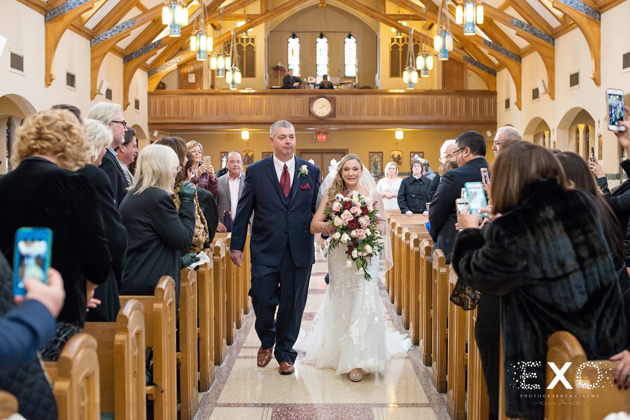 father walking bride down the aisle at Soundview Caterers wedding ceremony