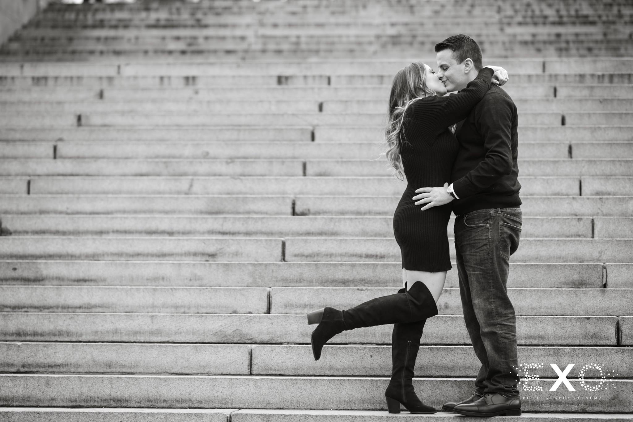 black and white image of couple kissing at Central Park engagement session
