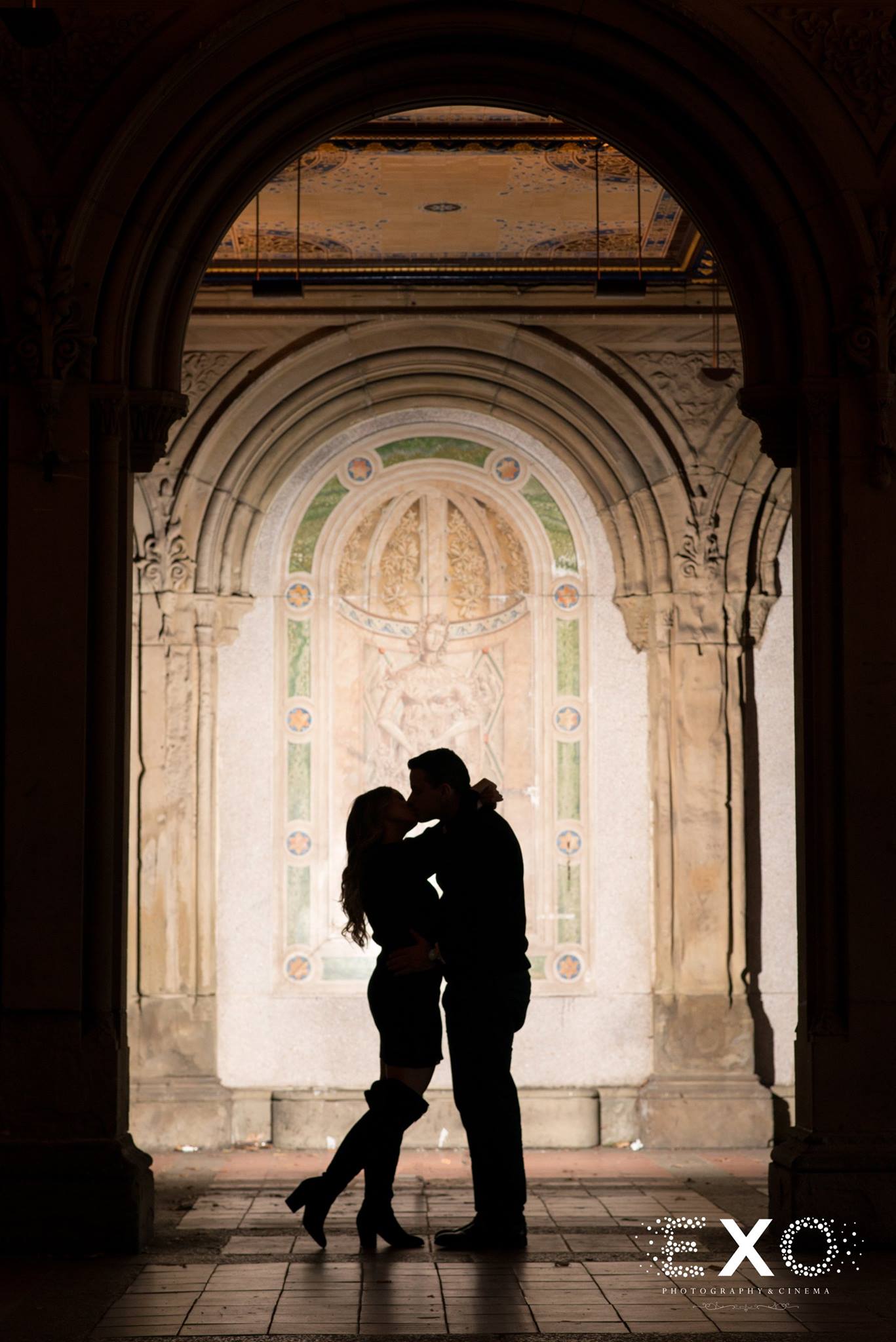 silhouette shot of couple kissing in building at Central Park